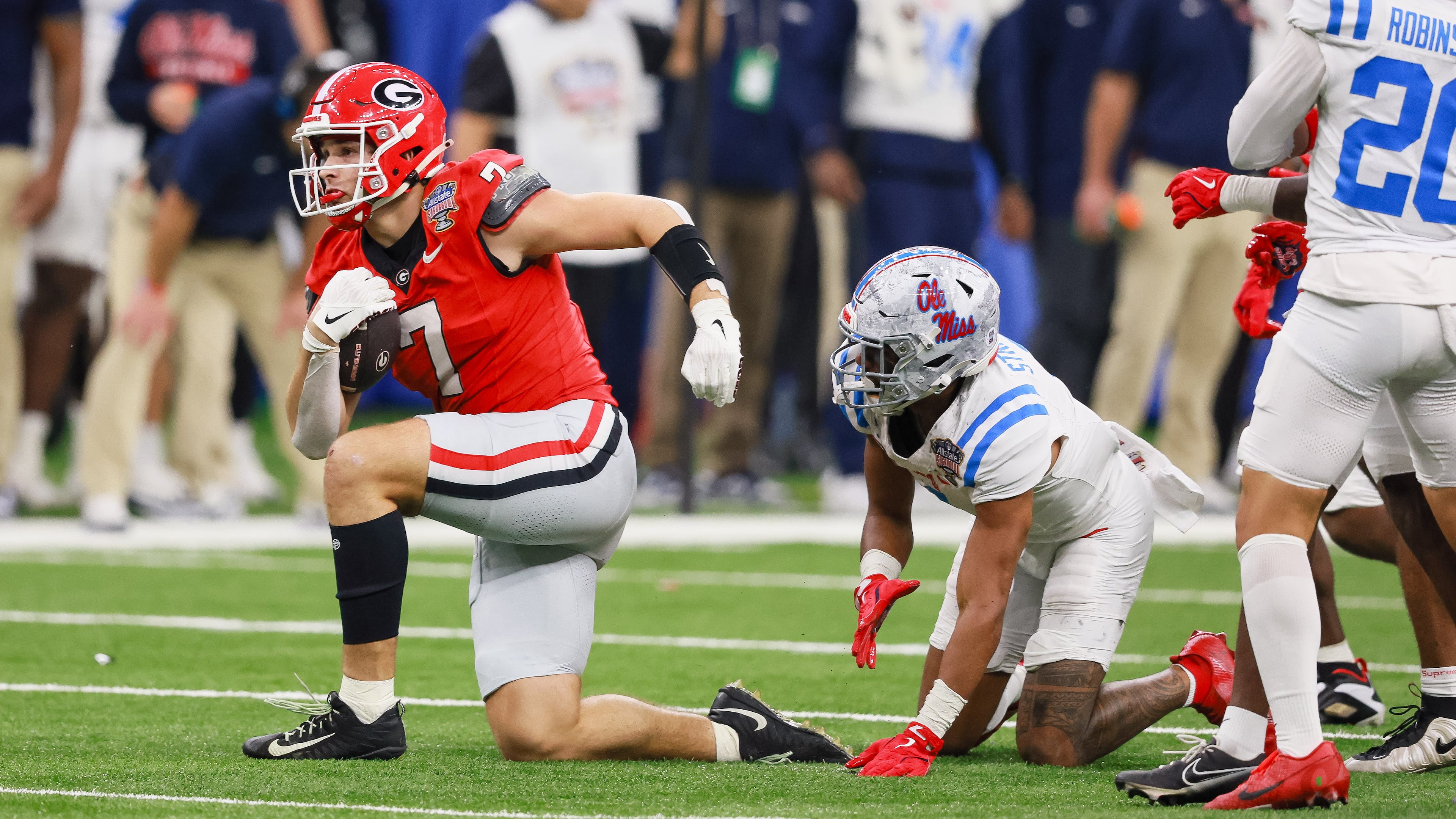 Georgia tight end Lawson Luckie (left) — pictured during the College Football Playoff game against Ole Miss in January — is one of seven Bulldogs who will have an extra year to play in college, should they so choose, under the new "5-in-5." (Jason Getz/AJC 2026)