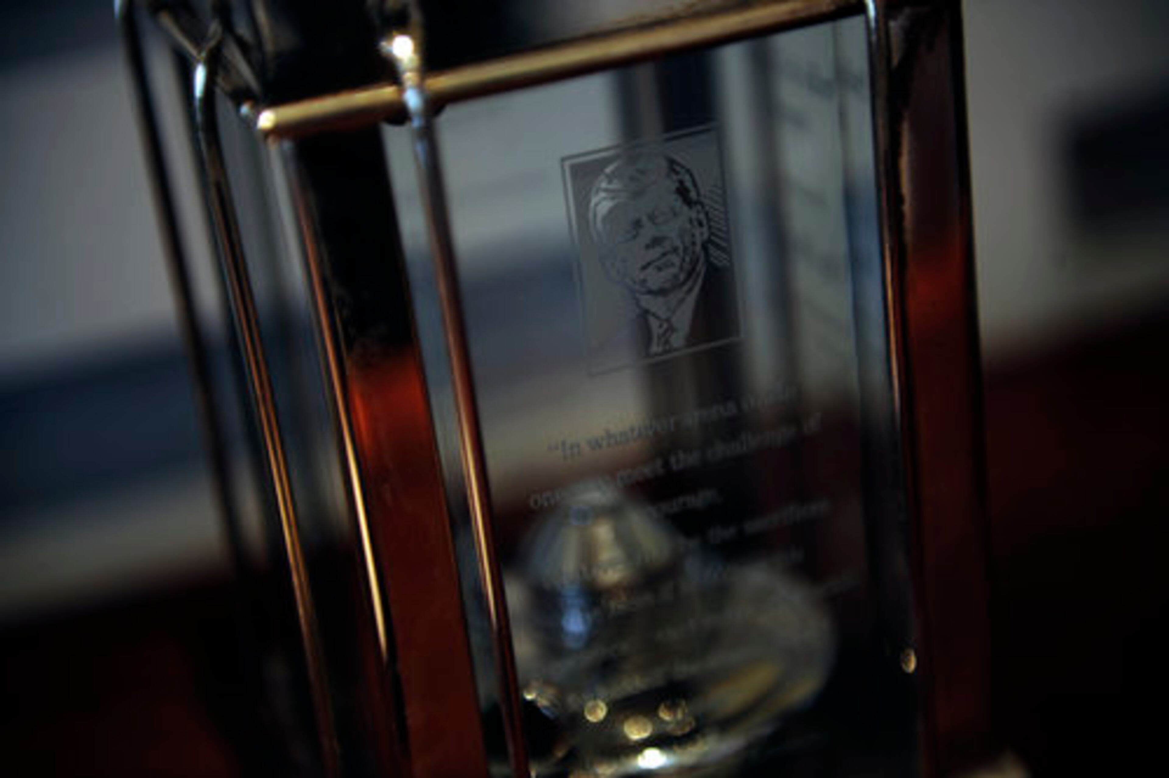 Displayed beneath Roy's portrait is the Profile in Courage Award he received from the John F. Kennedy Library Foundation. "He got it for changing the flag," Marie says. "It was a courageous thing to do, and it cost him his job." The award takes its name from Kennedy's book about U.S. Senators "who risked their careers by taking principled stands for unpopular positions," according to the foundation's Web site.