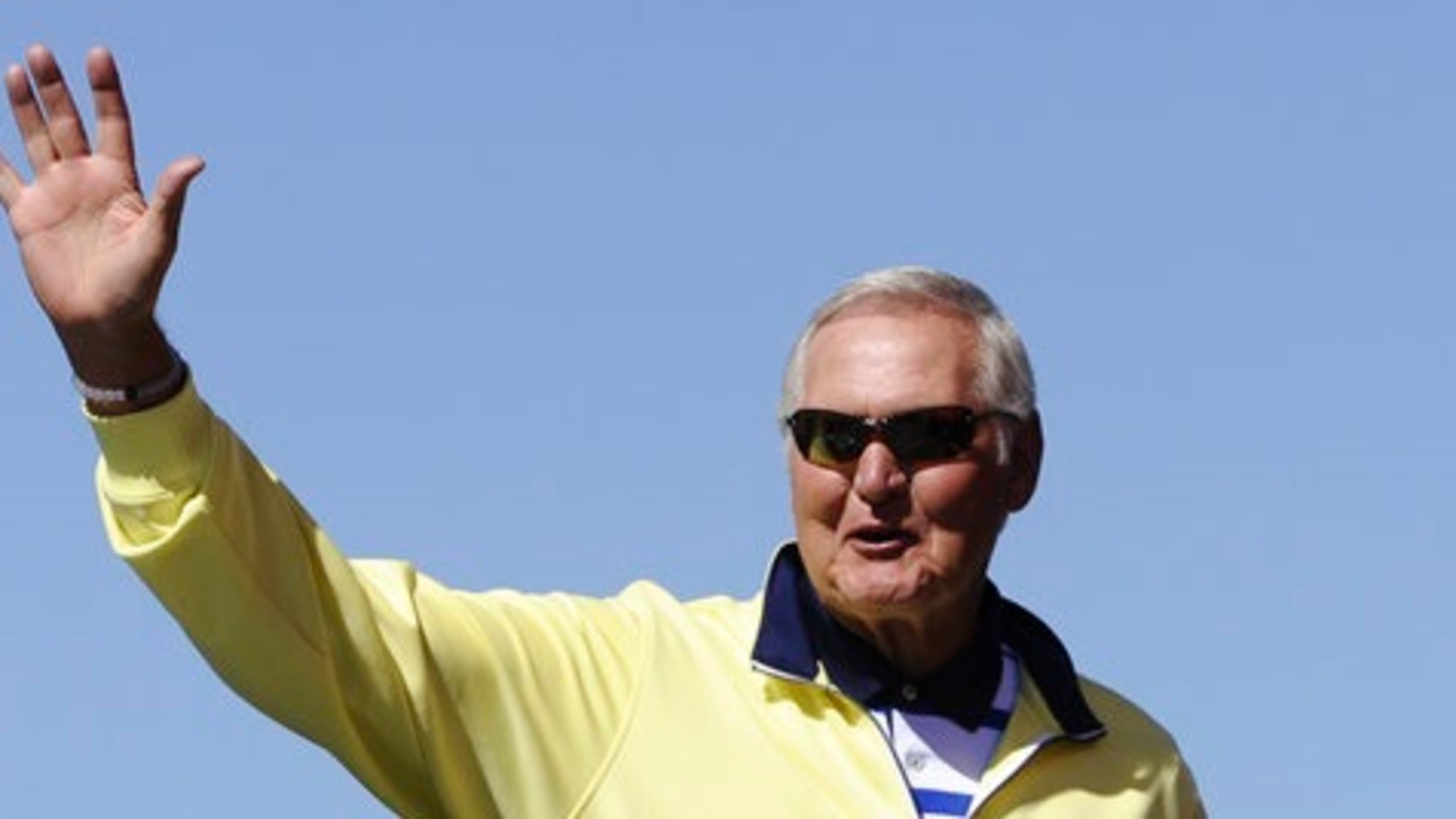 In this Sept. 20, 2015, file photo, former NBA player Jerry West greets fans during drivers introduction for the NASCAR Sprint Cup Series auto race at Chicagoland Speedway in Joliet, Ill. West could be leaving his job as an adviser to the NBA champion Golden State Warriors to take a similar role with the Los Angeles Clippers. West told ESPN he's intrigued at the prospect of working for team owner Steve Ballmer, whom he calls "a winner." (AP Photo/Matt Marton, File)
