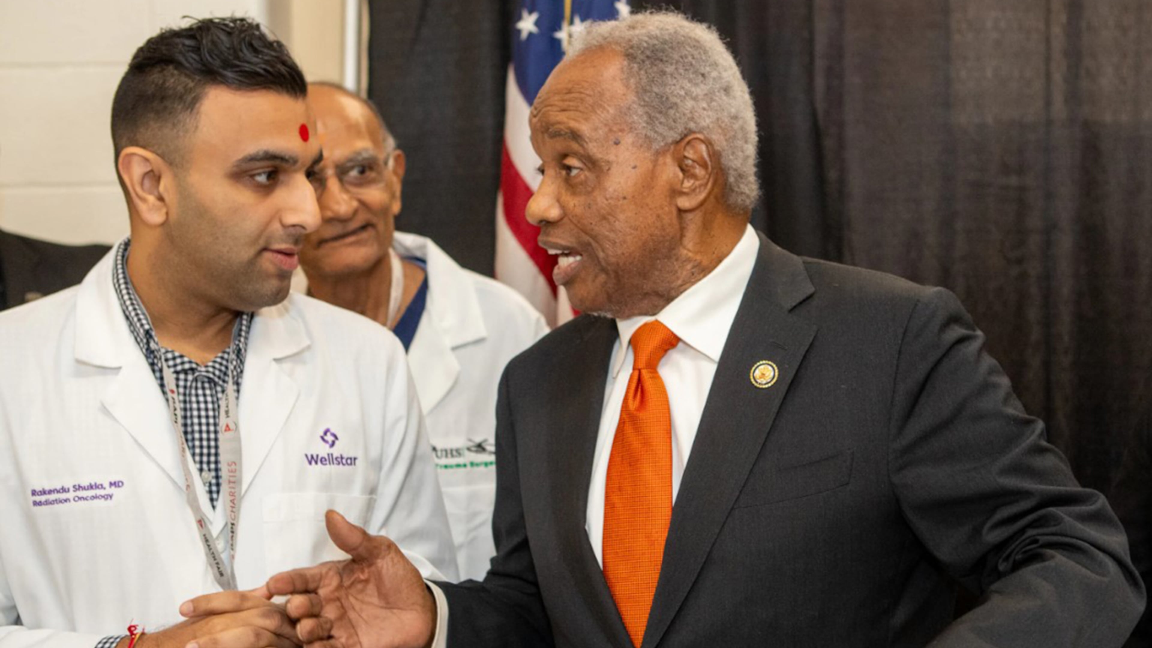 U.S. Rep. David Scott hosts his annual health fair on Saturday, Aug. 16, 2025, where he meets Wellstar Dr. Rakendu Shukla at Rockdale County High School in Conyers. (Jenni Girtman for the AJC)