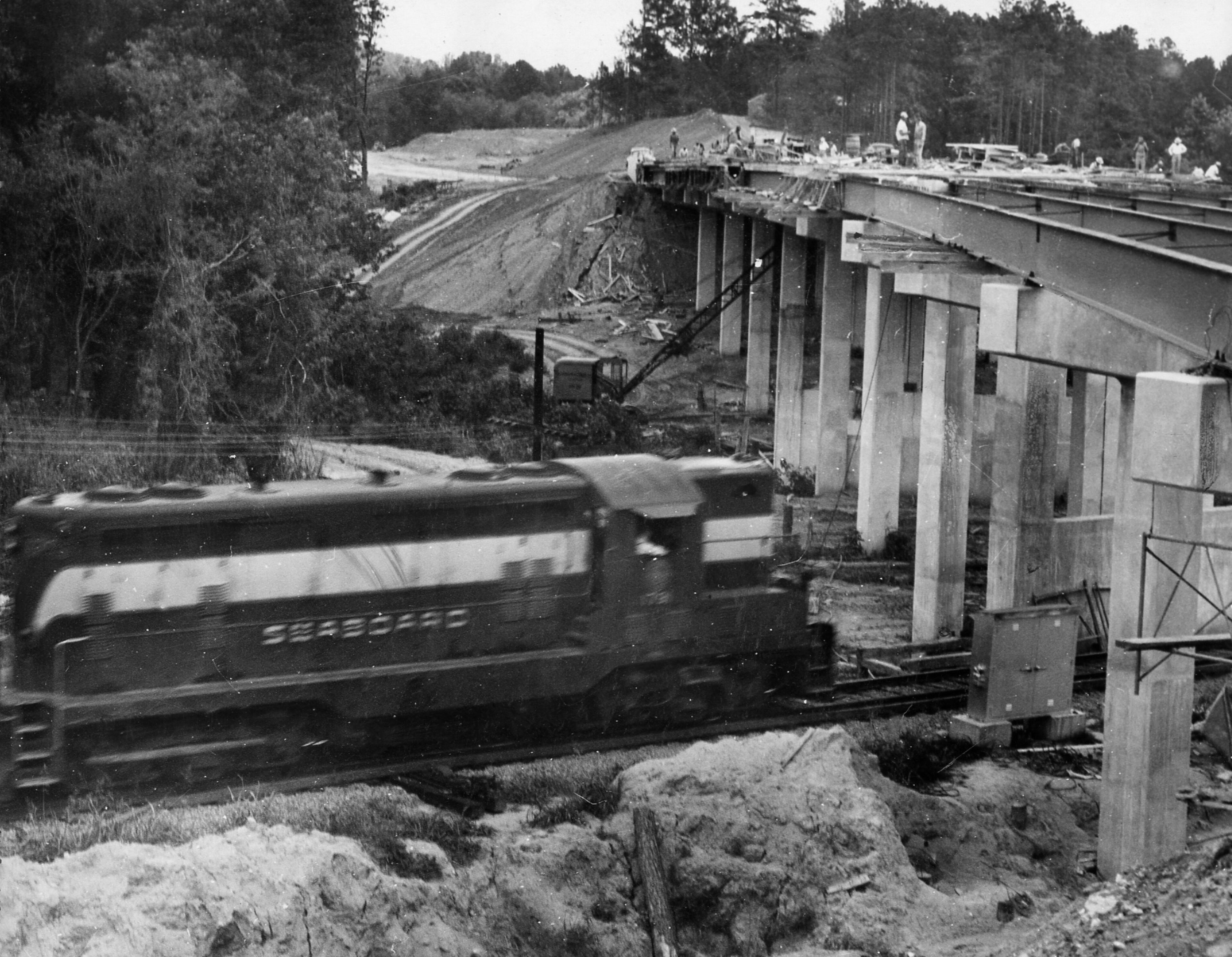 Atlanta, GA - (2nd of 3 photos) - Span crosses Seaboard Railroad and Peachtree Creek. It is the longest bridge (617 feet) on the Northeast leg of the expressway. (Van Toole/AJC staff) 1954