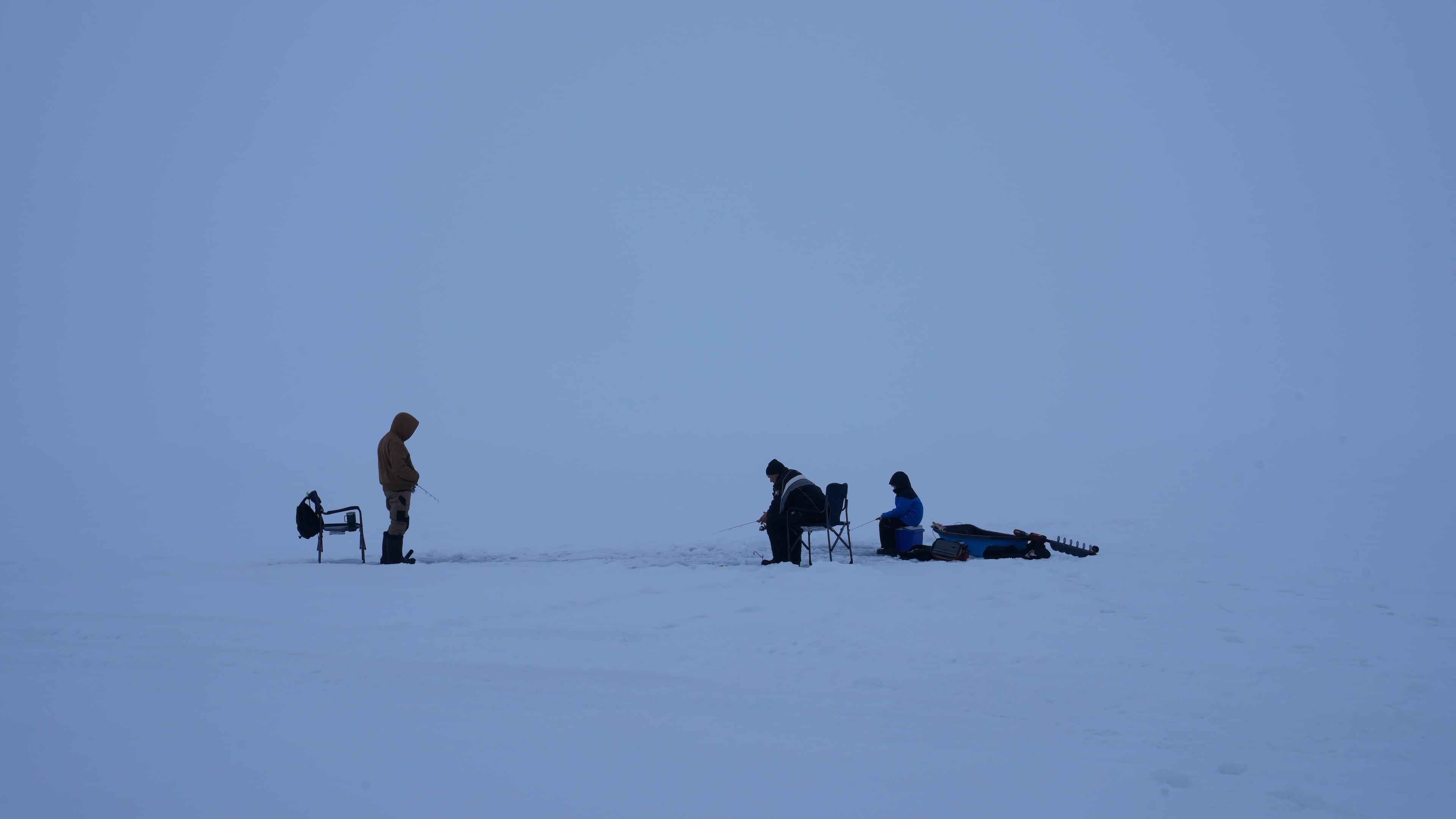 Fishermen cast their lines while ice fishing on Lake Simcoe in the Innisfil area north of Toronto, Wednesday, Jan. 7, 2026. (AP Photo/Kamran Jebreili)