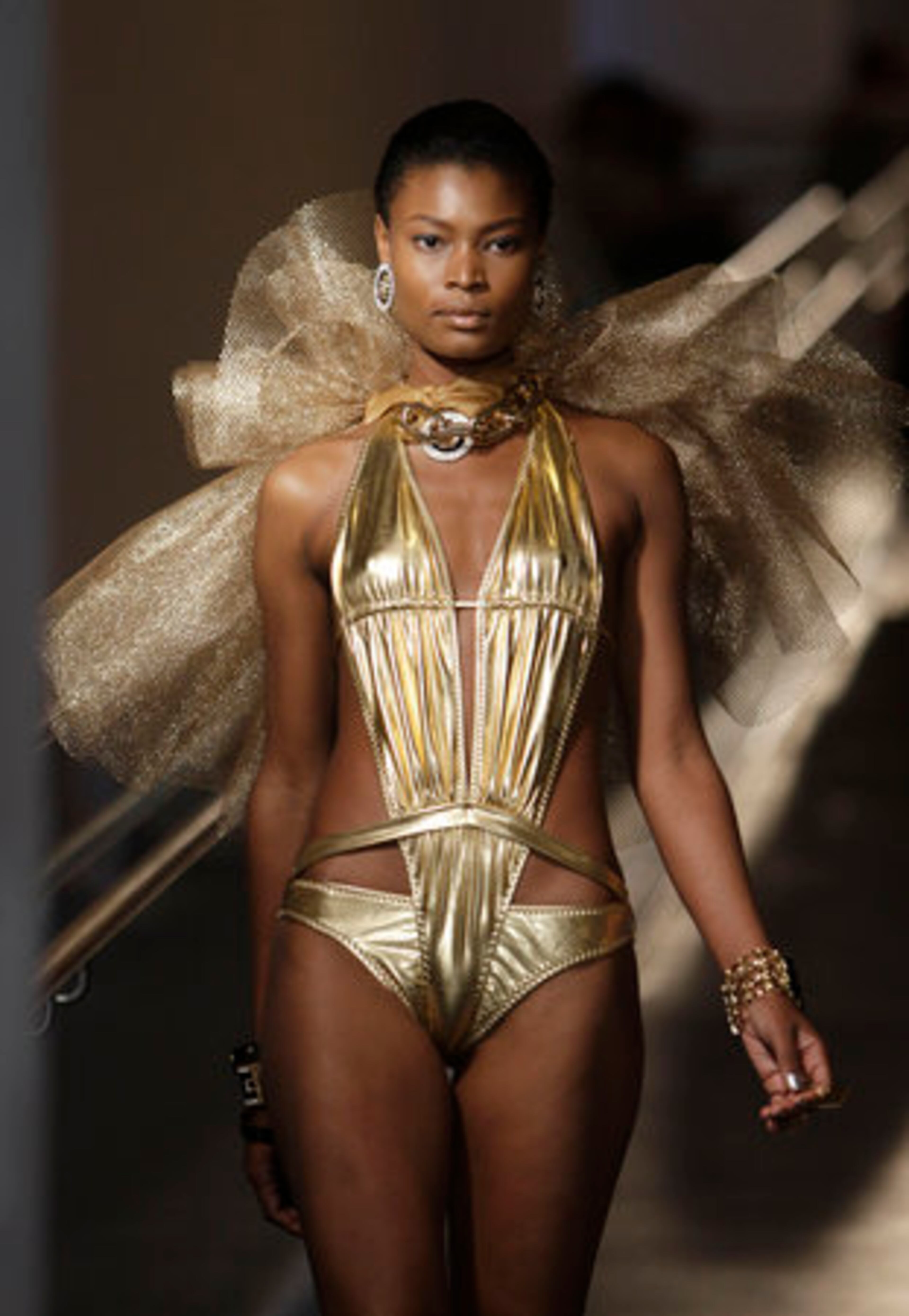 A model walks down the runway during the Mercedes-Benz Fashion Week Swim 2011 in Miami Beach, Fla.