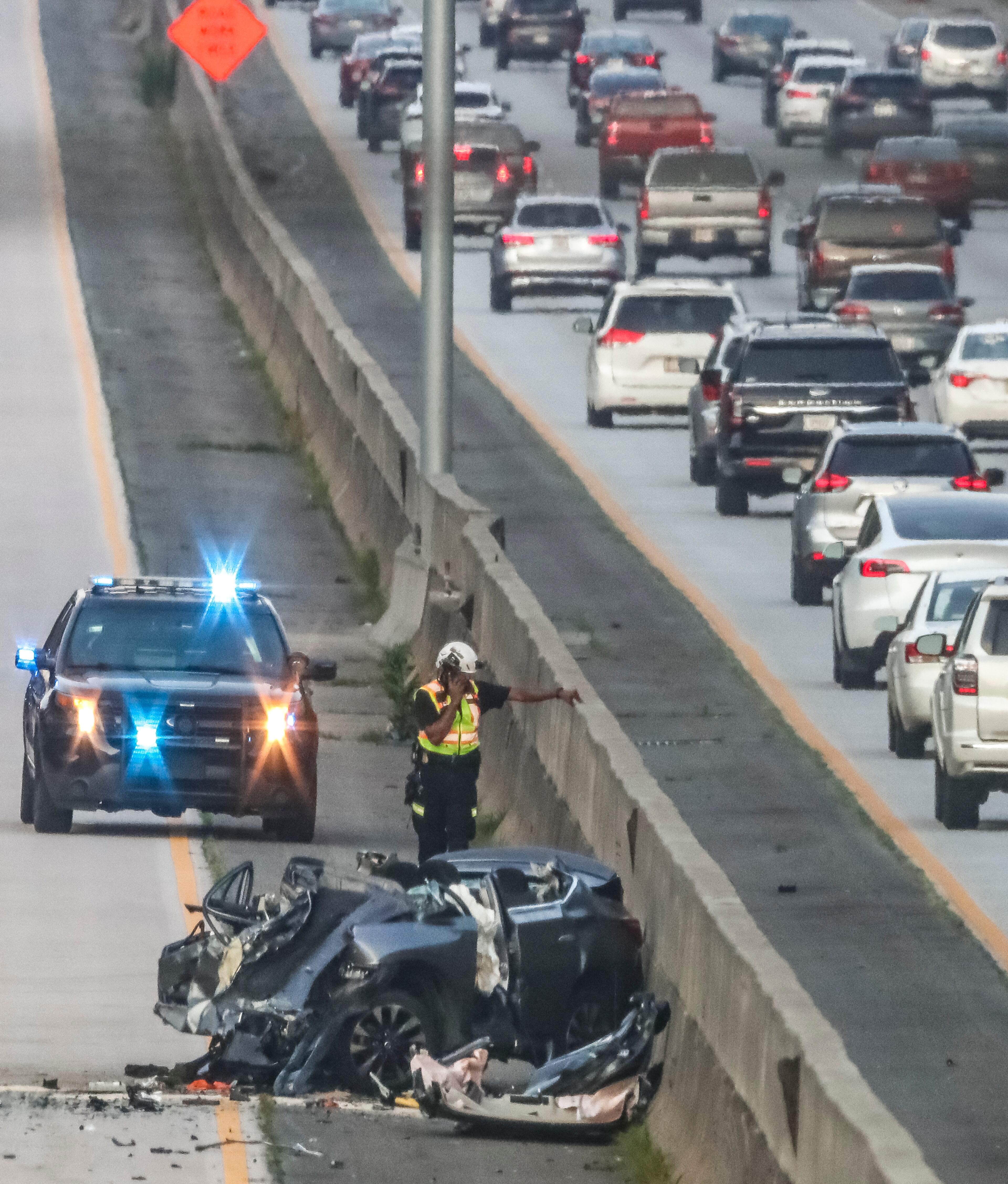 A fatal crash blocked all northbound lanes of Ga. 400 at Holcomb Bridge Road in Roswell last June. A spokesperson for the Governors Highway Safety Association says that the U.S. is experiencing "a traffic safety crisis," and that "we must do more of everything that works to better protect everyone on the road, both inside and outside a vehicle." (John Spink / John.Spink@ajc.com)