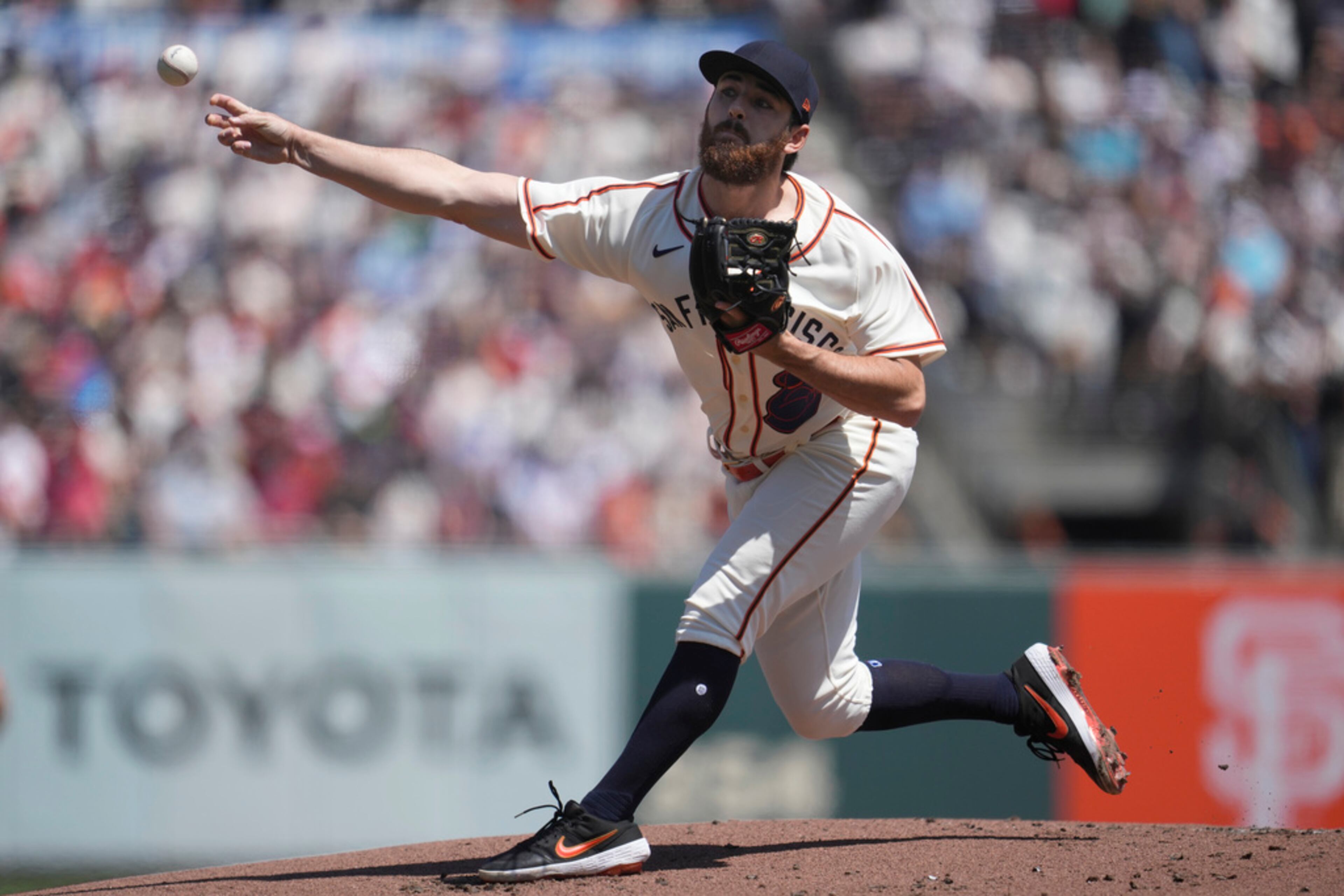 San Francisco Giants pitcher Ryan Walker works against the Atlanta Braves during the first inning of a baseball game in San Francisco, Saturday, Aug. 26, 2023. (AP Photo/Jeff Chiu)