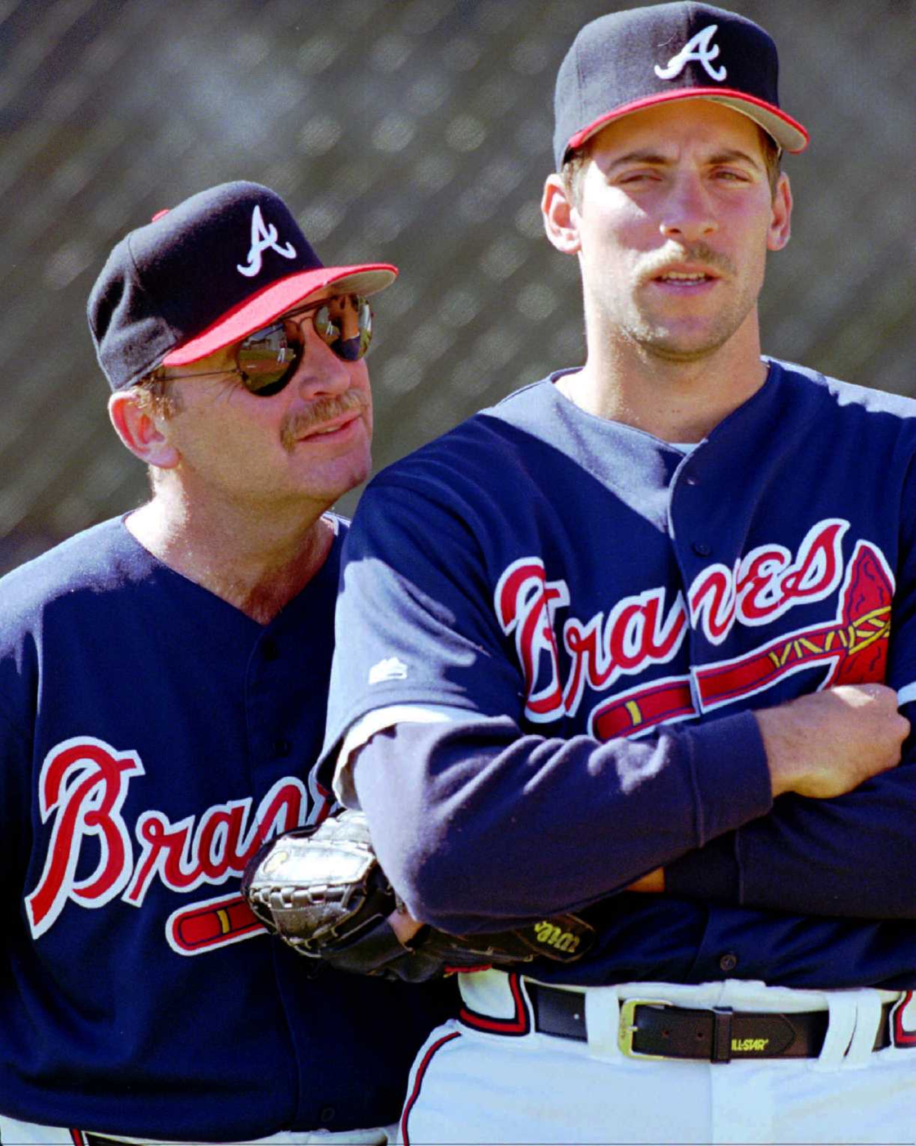 Braves pitching coach Leo Mazzone, left, talks to Smoltz again during spring training on Feb. 17, 1996.