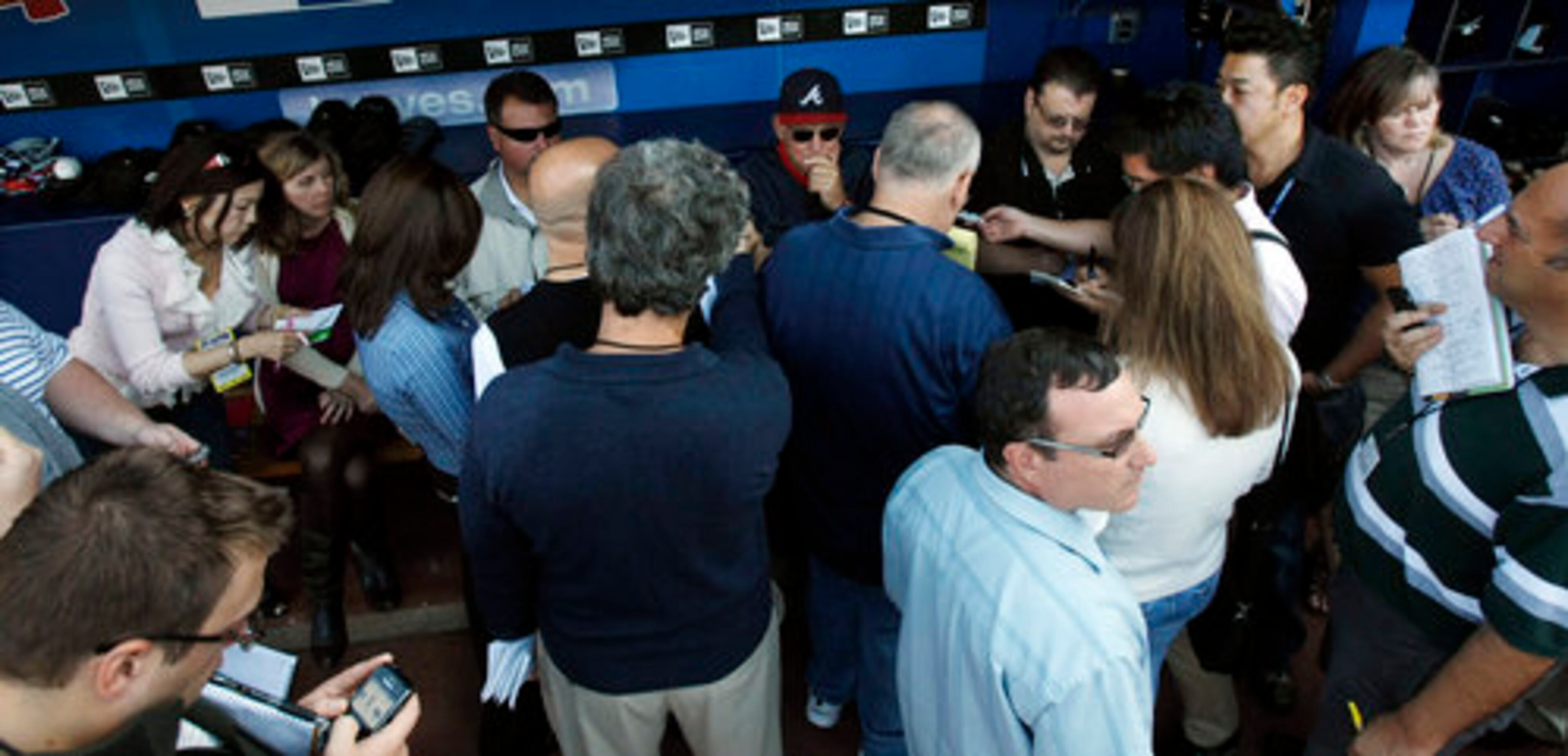 Bobby Cox, center, appears pensive before anwering a question as he is surrounded by news media before taking on the Phillies in the final series of the regular season at Turner Field in Atlanta on Friday, Oct. 1, 2010.