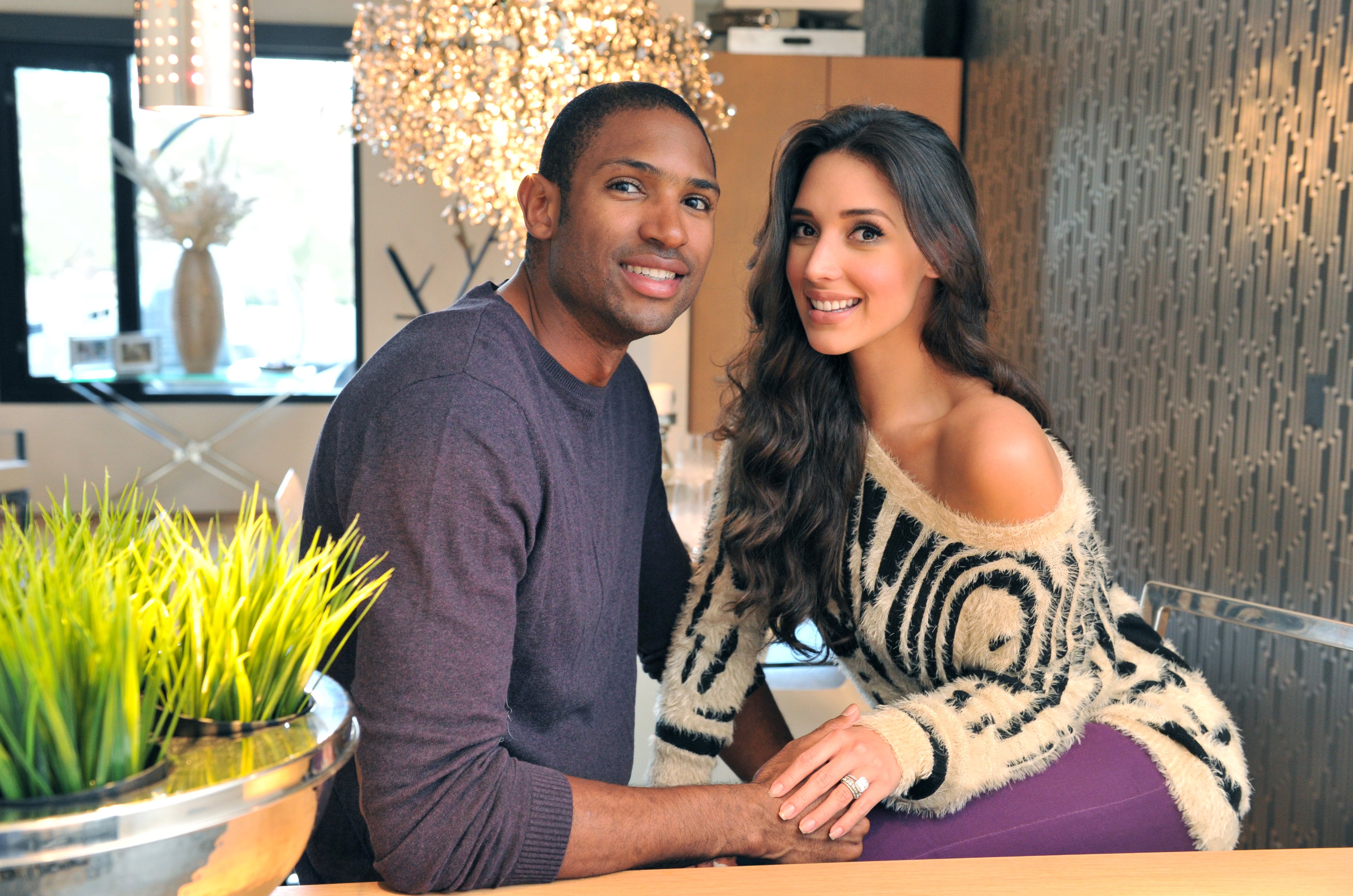 Portrait of Atlanta Hawks' Al Horford and his wife Amelia Vega at their home in Atlanta. When AJC food writer John Kessler heard that Atlanta Hawks center Al Horford was into good food, he suggested that they go to his favorite Dominican restaurant to show him the food he grew up with. But Al had a better idea: he invited Kessler into his home to sit down to a meal with his wife, Amelia Vega. Read the story behind Kessler's dinner with Al and Amelia.