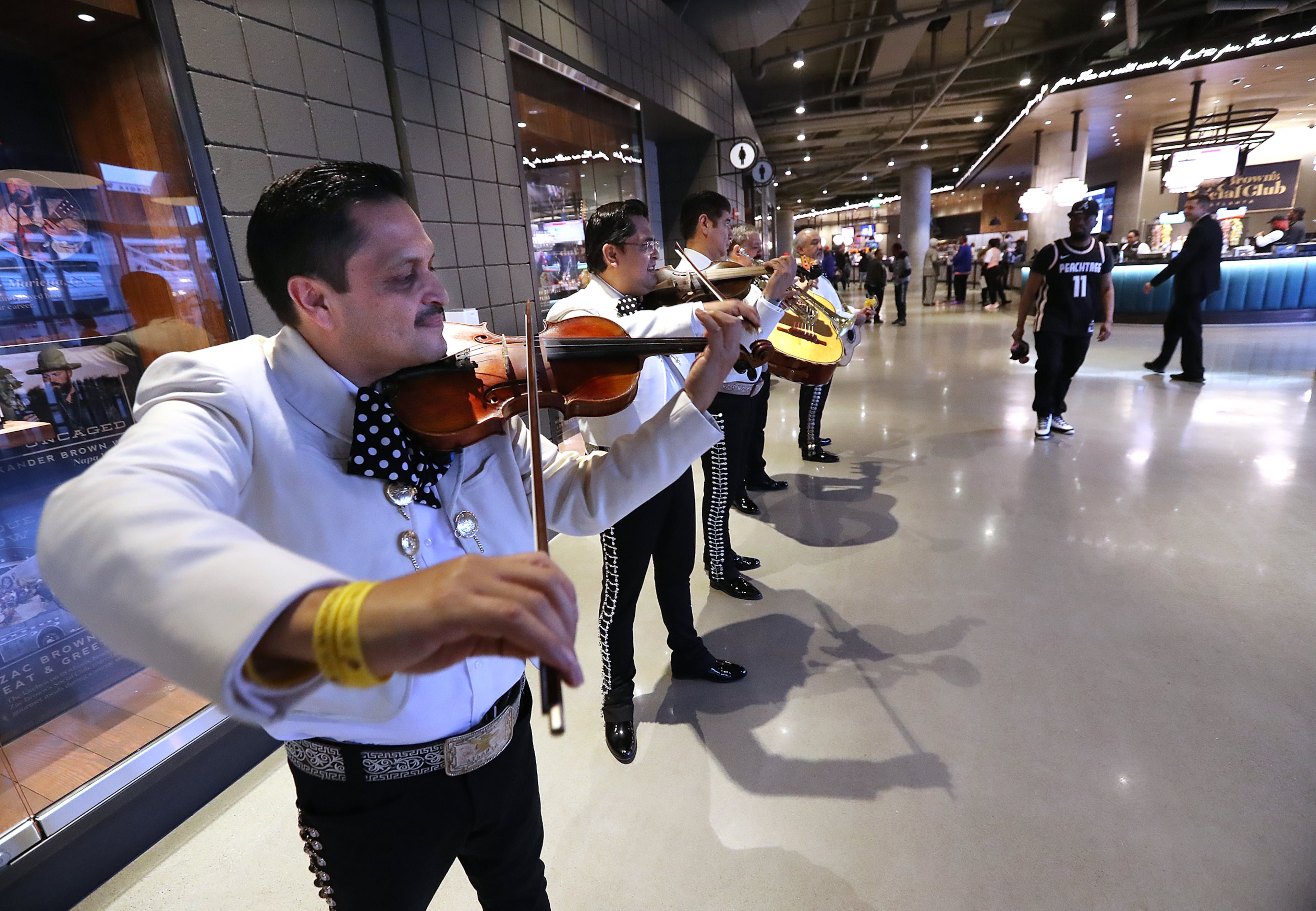 The music plays on despite the coronavirus as the Los Mariachis performs in State Farm Arena while the Atlanta Hawks play the New York Knicks in a NBA basketball game on Wednesday, March 11, 2020, in Atlanta. As the country grapples with coronavirus and how to best combat the spread of the disease, athletic teams and organizations are asking themselves that same question. Curtis Compton ccompton@ajc.com
