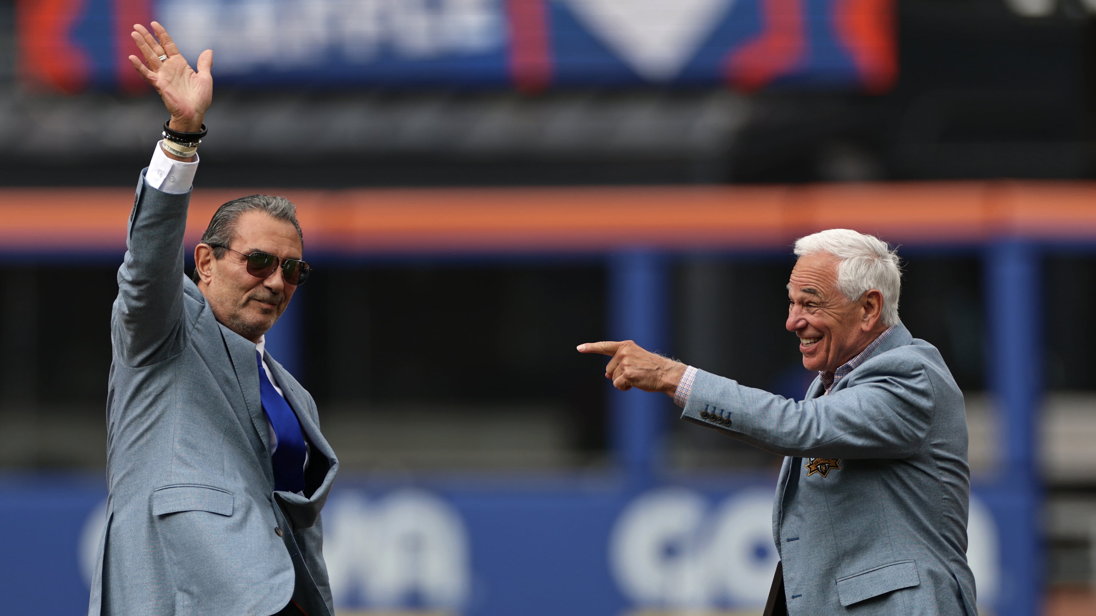 Lee Mazzilli, left, and Bobby Valentine wave and gesture during an induction ceremony into the New York Mets hall of fame before a baseball game against the Miami Marlins, Saturday, May 30, 2026, in New York. (AP Photo/Adam Hunger)