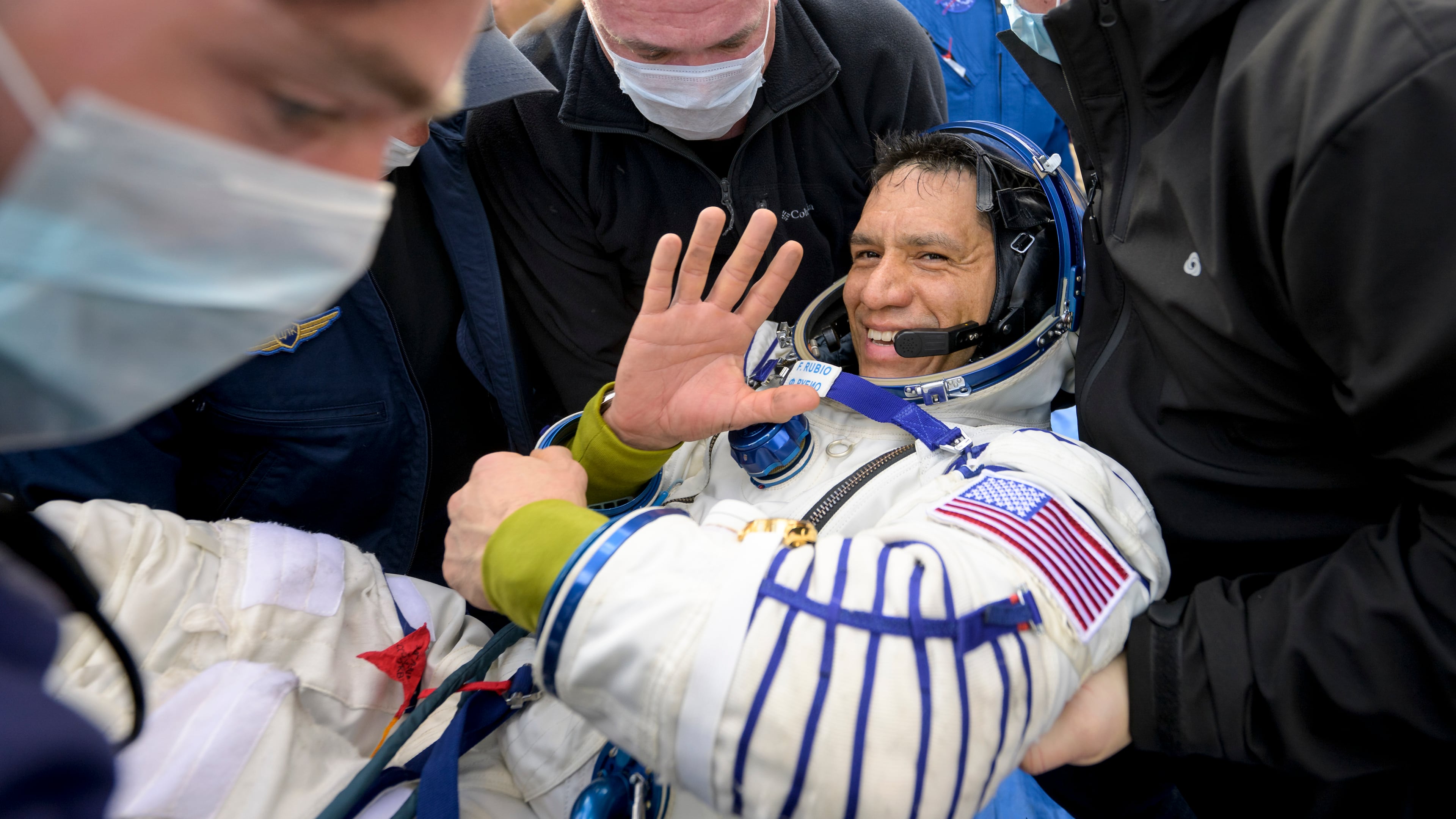 Frank Rubio, a NASA astronaut, is helped out of the Soyuz MS-23 spacecraft minutes after he and Roscosmos cosmonauts landed near Dzhezkazgan, Kazakhstan, on Wednesday, Sept. 27, 2023. Rubio safely returned to Earth after spending 371 days in space, a record in spaceflight for American astronauts. He will return to orbit next year aboard the Orion spacecraft. (Bill Ingalls/NASA via The New York Times)