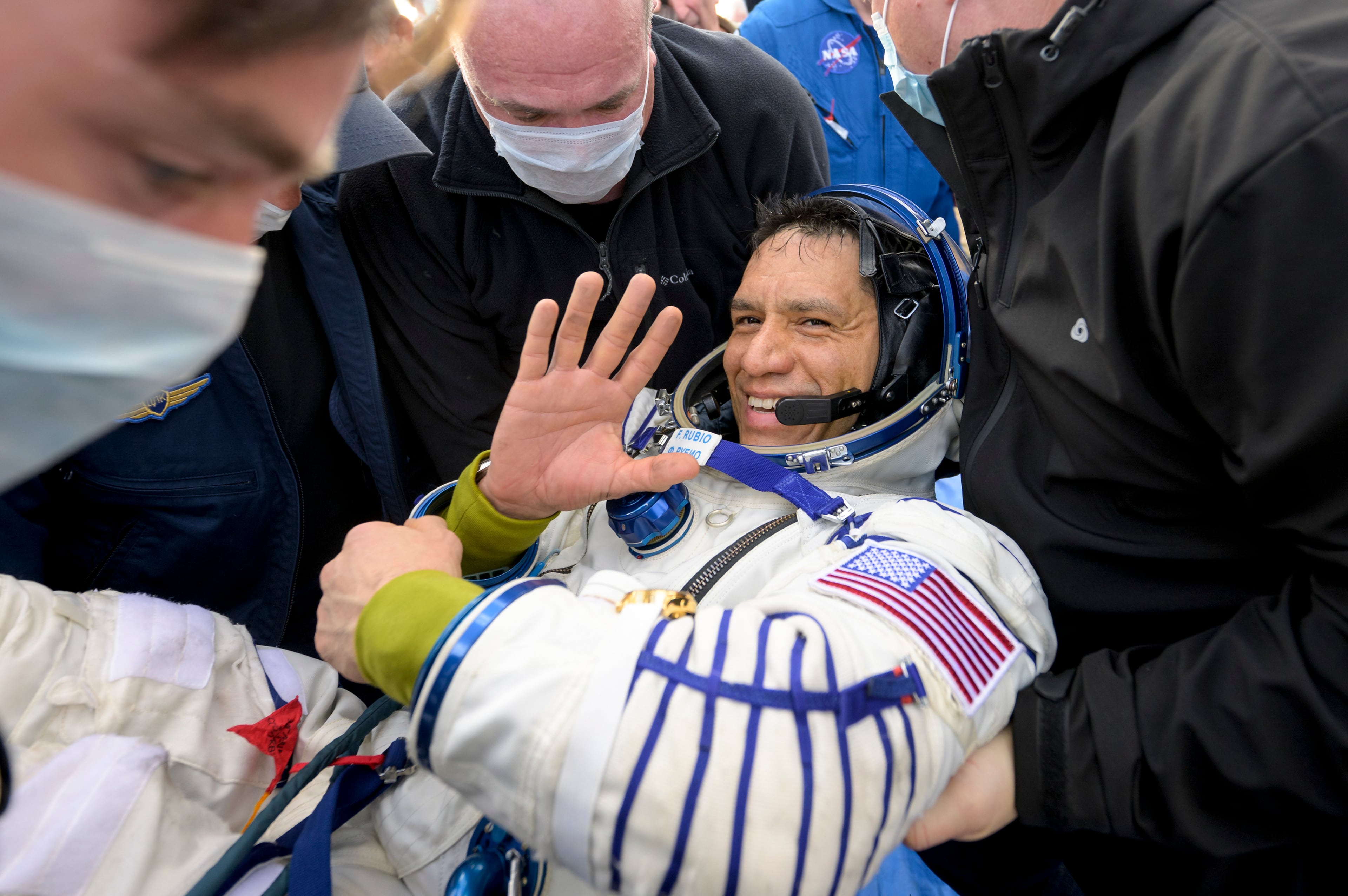 Frank Rubio, a NASA astronaut, is helped out of the Soyuz MS-23 spacecraft minutes after he and Roscosmos cosmonauts landed near Dzhezkazgan, Kazakhstan, on Wednesday, Sept. 27, 2023. Rubio safely returned to Earth after spending 371 days in space, a record in spaceflight for American astronauts. He will return to orbit next year aboard the Orion spacecraft. (Bill Ingalls/NASA via The New York Times)