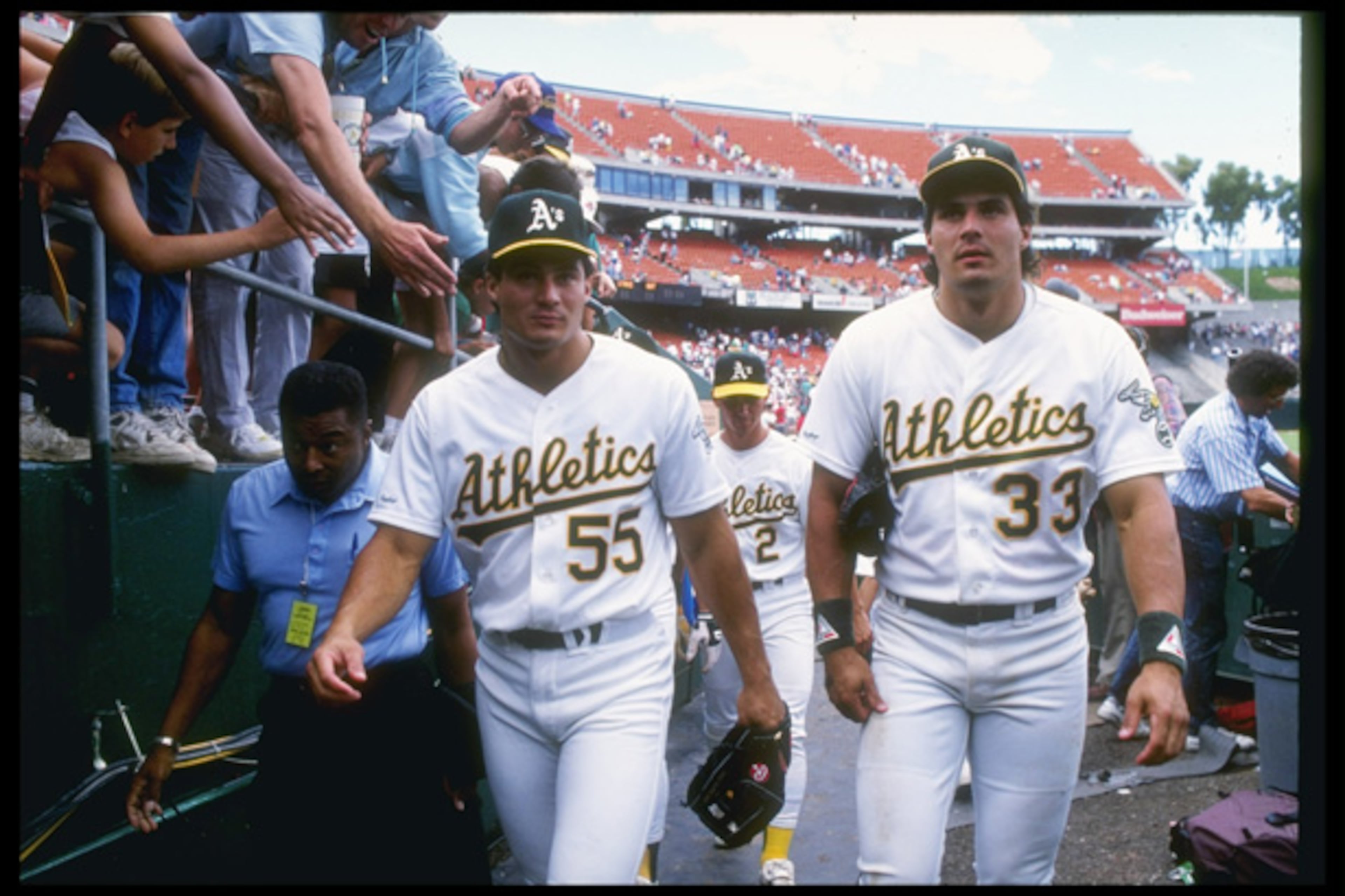 Brothers Ozzie (left) and Jose Canseco were teammates with the Oakland Athletics in 1990.