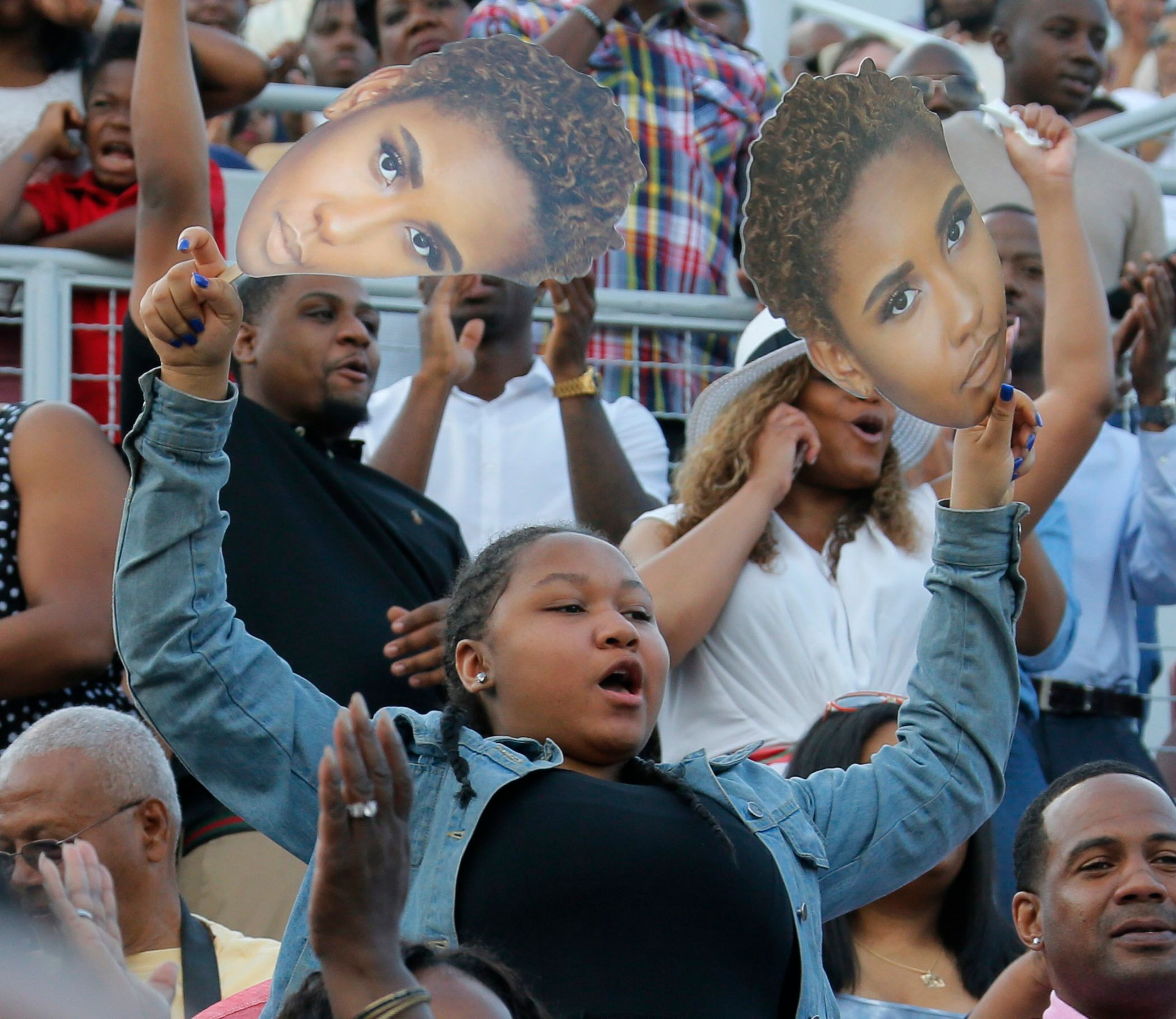 5/22/17 - Atlanta - Family members watch as graduates enter the stadium during the processional. Clark Atlanta University's Panther Stadium was the site of their 28th annual Commencement. Businessman William Pickard gave the commencement address. Rev. Jesse Jackson, who received an honorary degree, also spoke. Panther Stadium, BOB ANDRES /BANDRES@AJC.COM