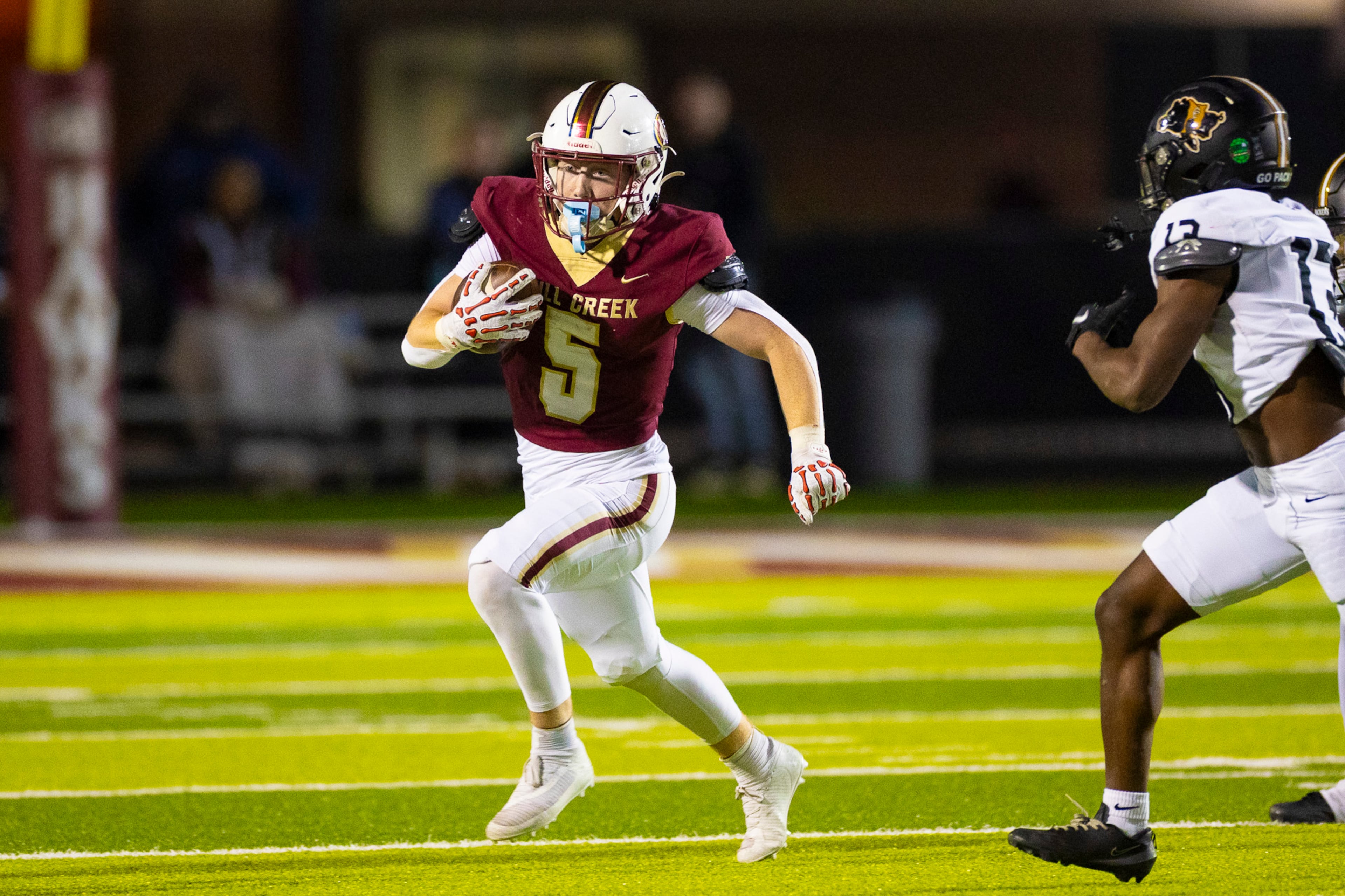 Mill Creek wide receiver Carson Hurter (5) runs with the ball during the second half against Colquitt County at Mill Creek Community Stadium, Friday, Nov. 14, 2025, in Hoschton, Ga. (Oscar Guevara Saenz for the AJC)