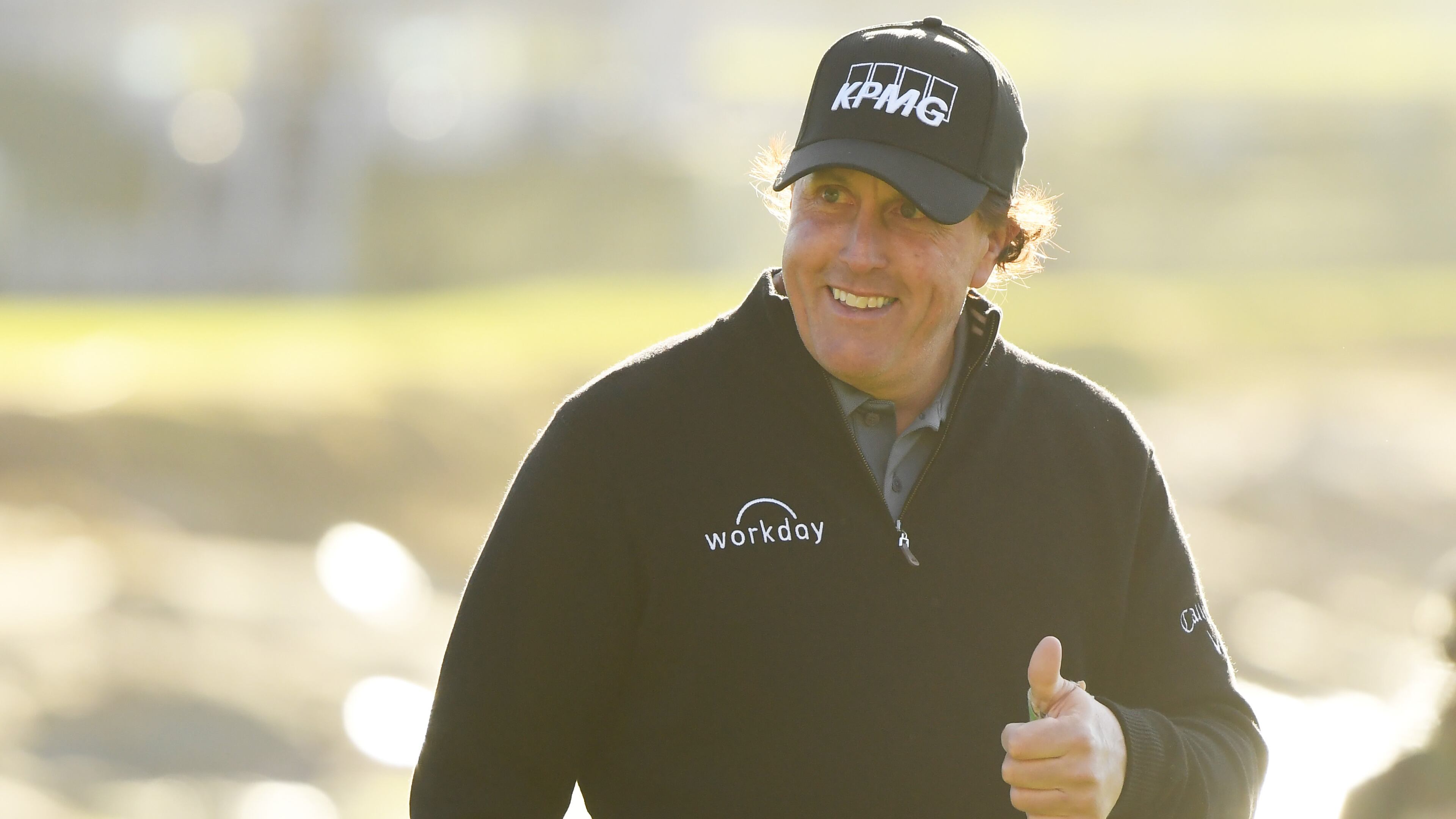Phil Mickelson shows his pleasure, walking up the 18th at Pebble Beach Monday with a comfortable lead.