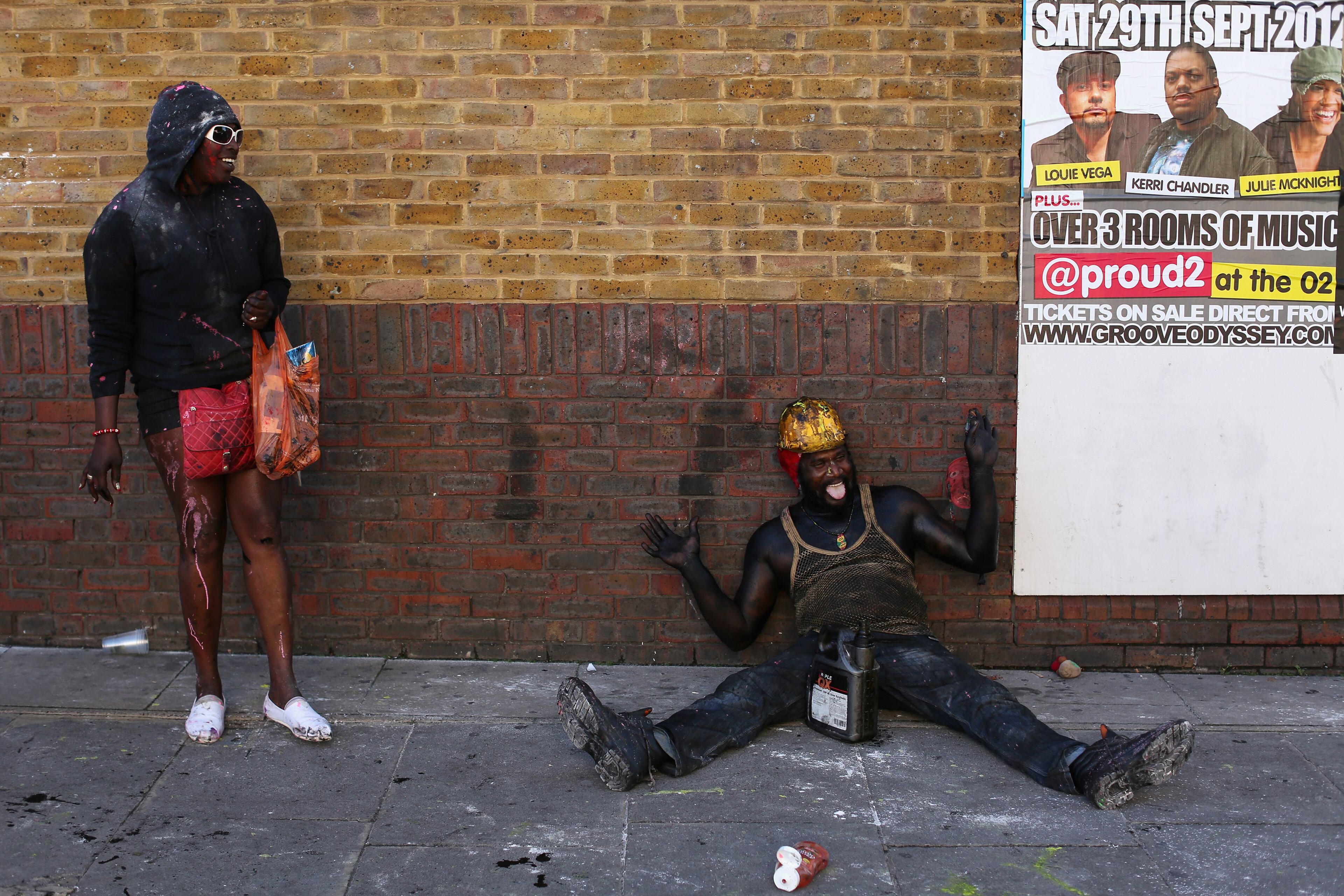 LONDON, ENGLAND - AUGUST 26: A reveller is covered in paint on the family day at the Notting Hill Carnival on August 26, 2012 in London, England. The annual 2-day carnival, which is the largest of its kind in Europe and is expected to attract around 1 million revellers, has taken place every August Bank Holiday since 1966. (Photo by Oli Scarff/Getty Images)