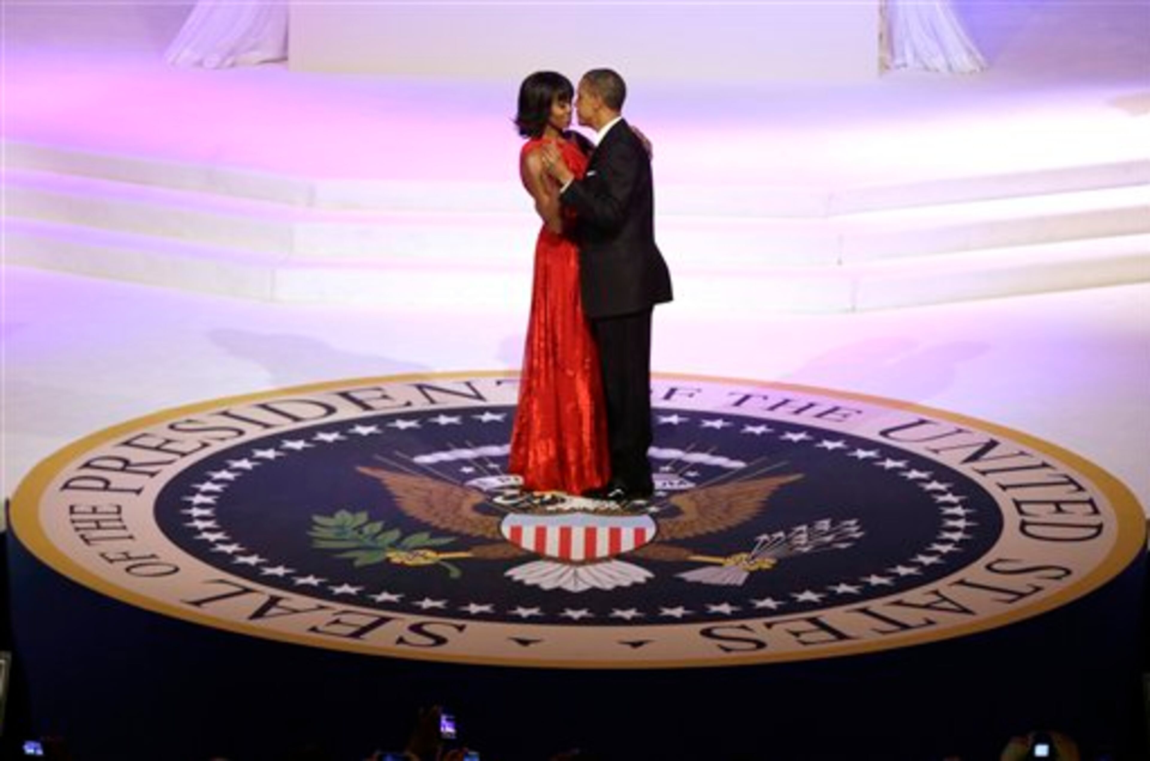 President Barack Obama and first lady Michelle Obama dance during the Commander-In-Chief Inaugural ball at the Washington Convention Center during the 57th Presidential Inauguration Monday, Jan. 21, 2013 in Washington. (AP Photo/ Evan Vucci)