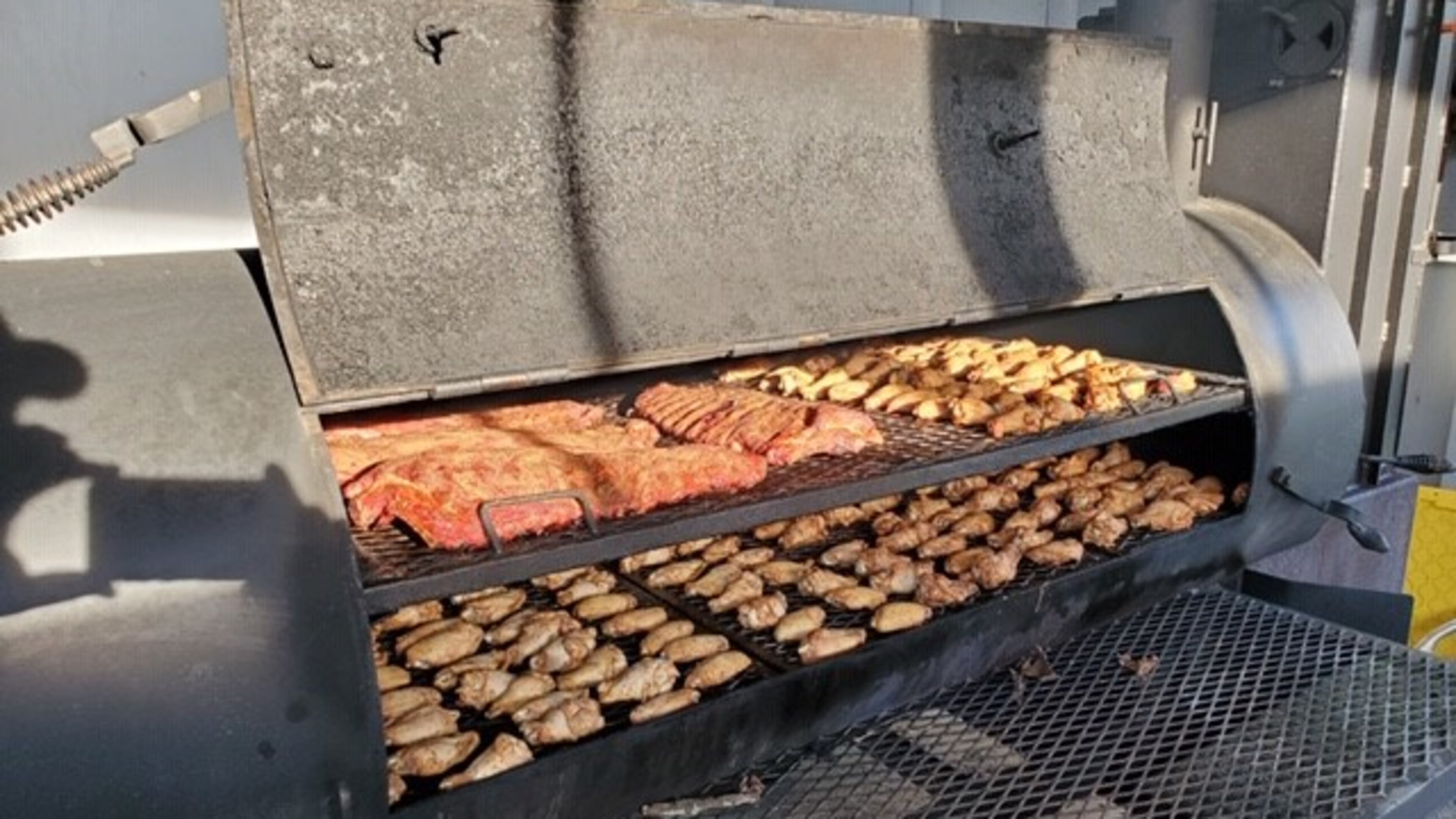 Meat on the smoker at Taylor'd Bar-B-Q.