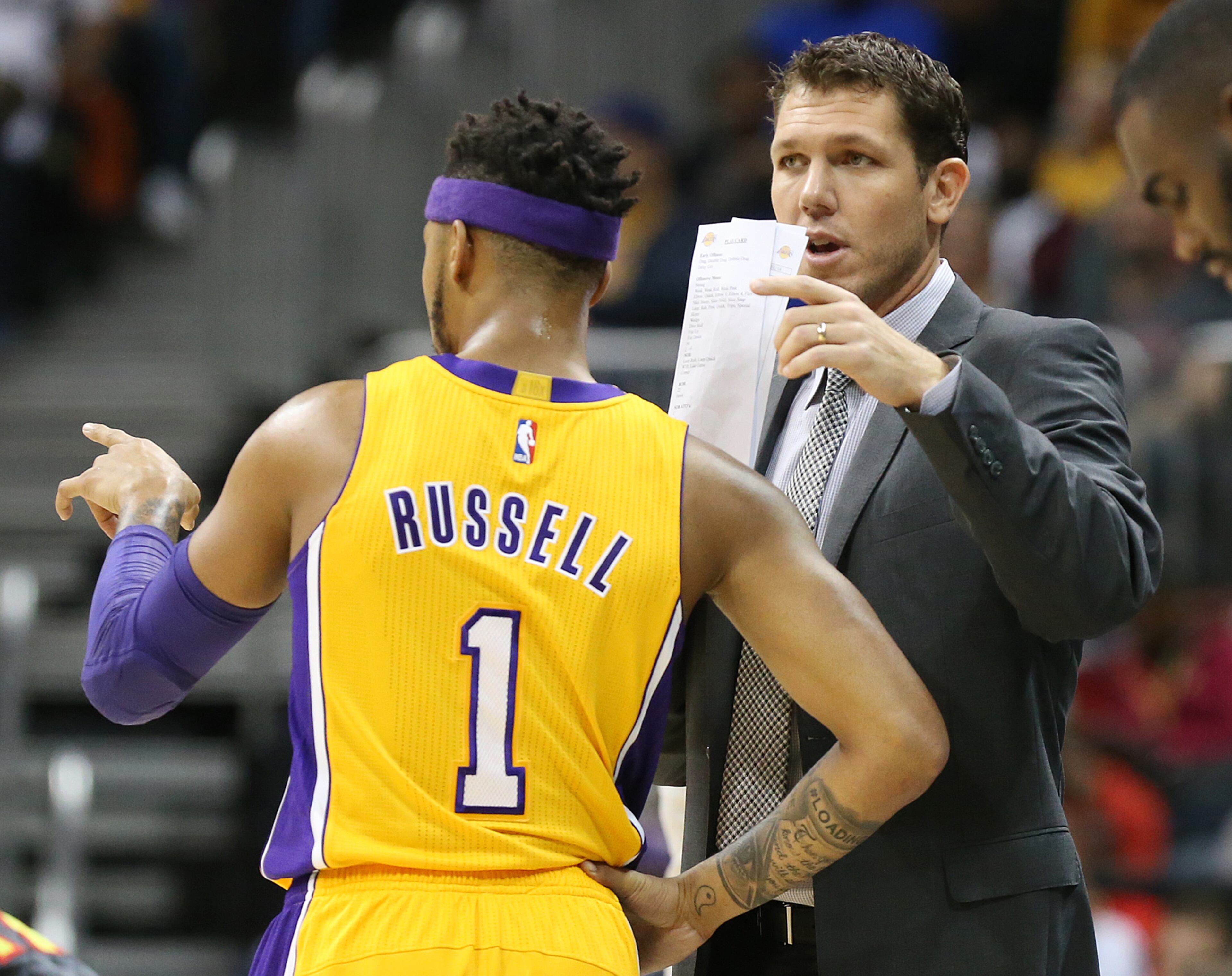 Lakers head coach Luke Walton confers with D'Angelo Russell during the first period in an NBA basketball game against the Hawks at Philips Arena on Wednesday, Nov. 2, 2016, in Atlanta. Curtis Compton /ccompton@ajc.com