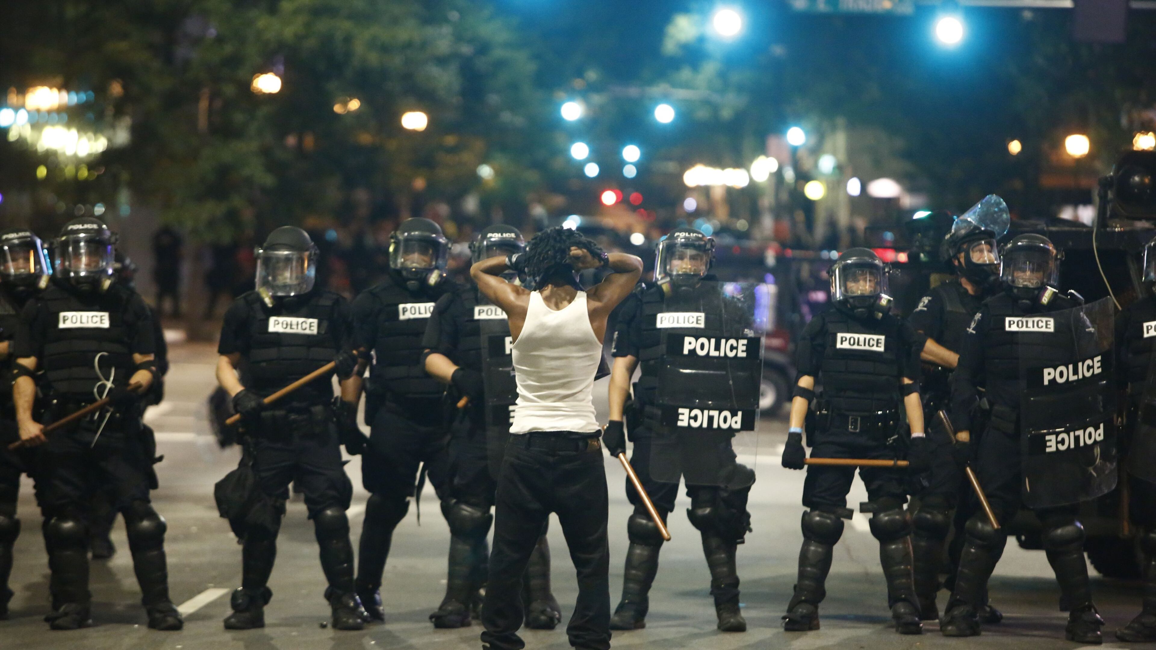 Police clash with protestors as residents and activists protest the death of Keith Scott in Charlotte.