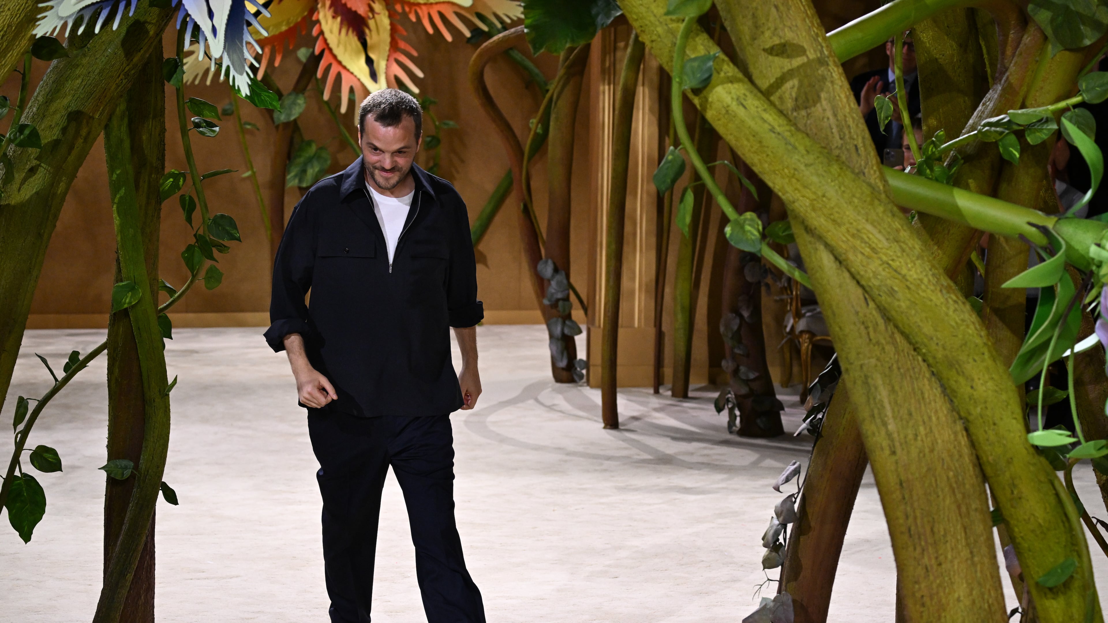 Designer Matthieu Blazy accepts applause after the Chanel Haute Couture Fall/Winter 2026-2027 Women's collection presented in Paris, Tuesday, July 7, 2026. (AP Photo/Emma Da Silva)