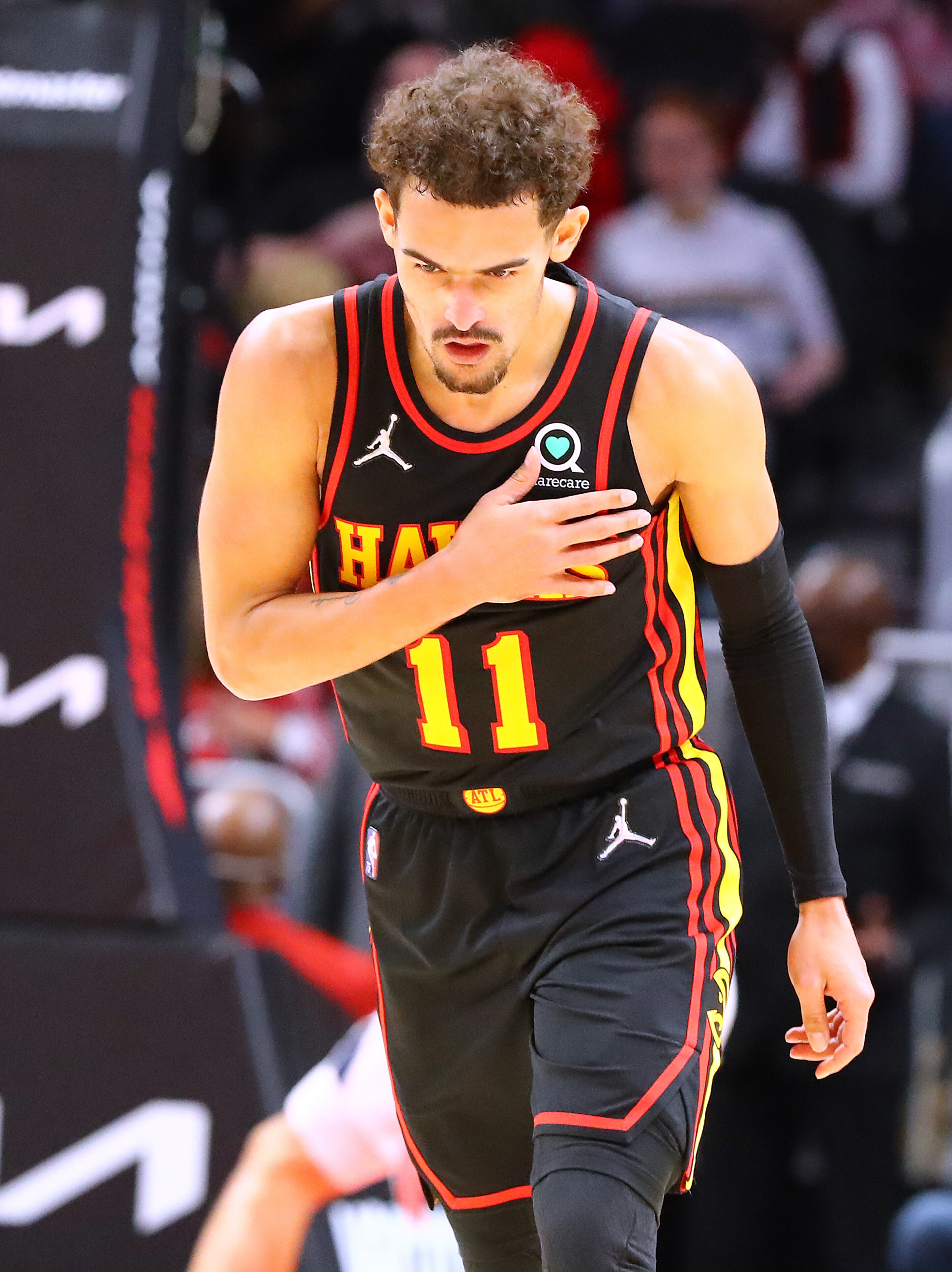Hawks guard Trae Young pats himself on the chest after hitting a 3-pointer against the Indiana Pacers during the third period of a 133-112 victory in an NBA game on Tuesday, Feb. 8, 2022, in Atlanta. “Curtis Compton / Curtis.Compton@ajc.com”`