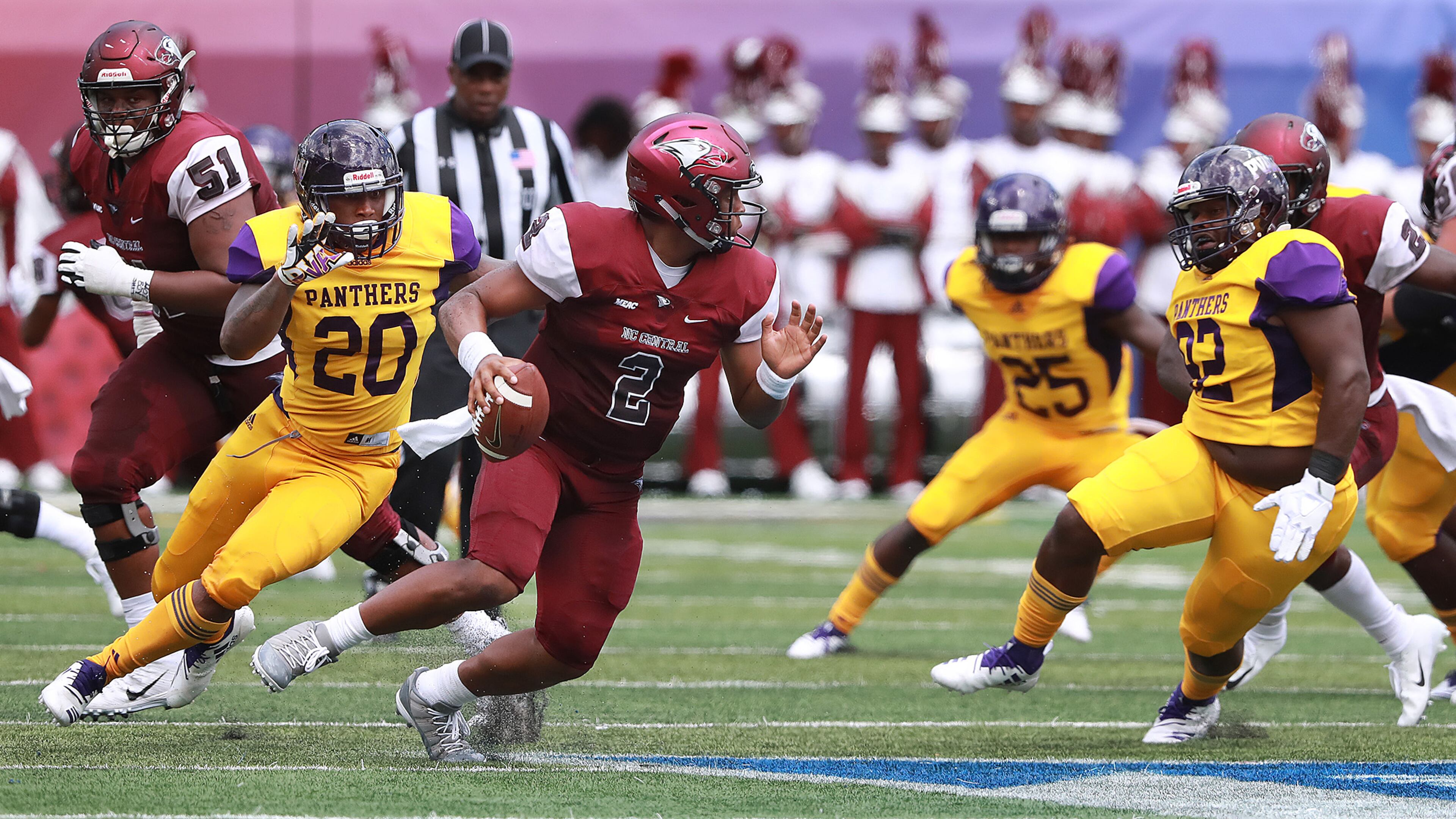 North Carolina Central quarterback Chauncey Caldwell looks to pass under pressure from Prairie View A&M defenders during the MEAC-SWAC Challenge Sunday, Sept. 2, 2018, in Atlanta.