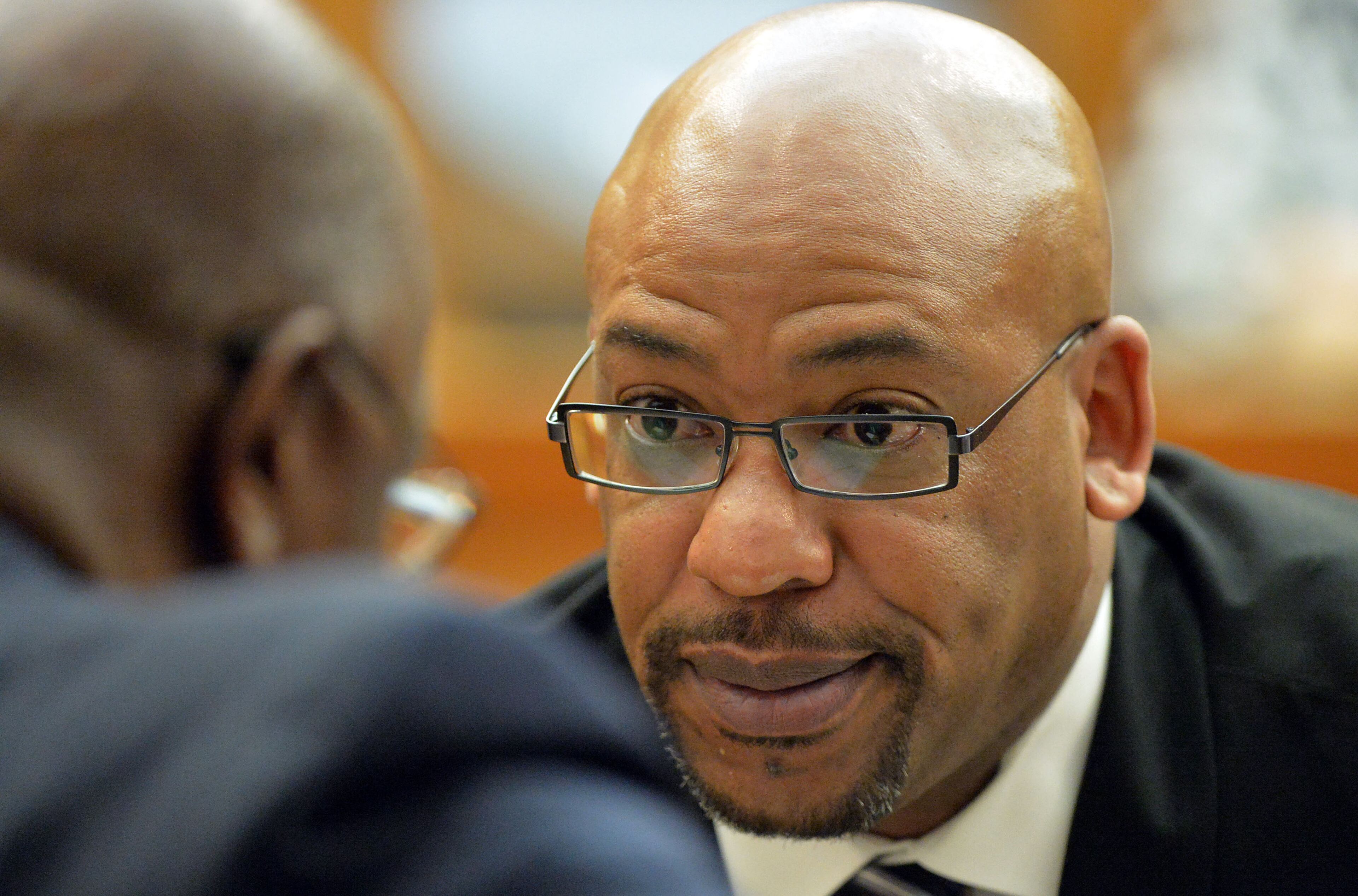 Fulton County Senior ADA Clint Rucker talks with Fulton County DA Paul Howard. Sentencing continues for 10 of the 11 defendants convicted of racketeering and other charges in the Atlanta Public Schools test-cheating trial before Judge Jerry Baxter in Fulton County Superior Court, Tuesday, April 14, 2015. (Atlanta Journal-Constitution, Kent D. Johnson, Pool)