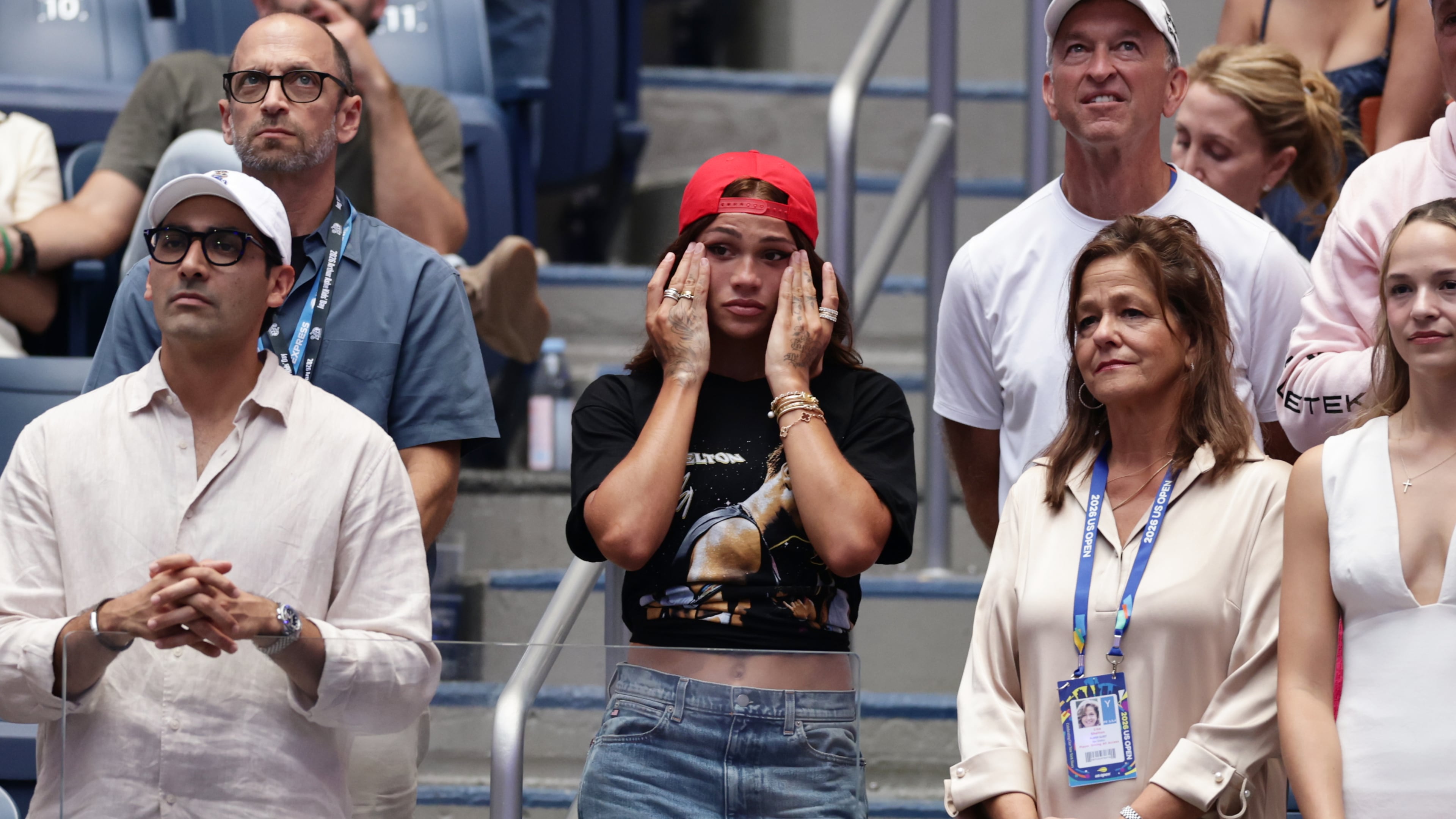 Soccer player Trinity Rodman, center, reacts after her boyfriend Ben Shelton, of the United States, lost the men's singles final of the U.S. Open tennis championships against Alexander Zverev, of Germany, Sunday, Sept. 13, 2026, in New York. (AP Photo/Adam Hunger)