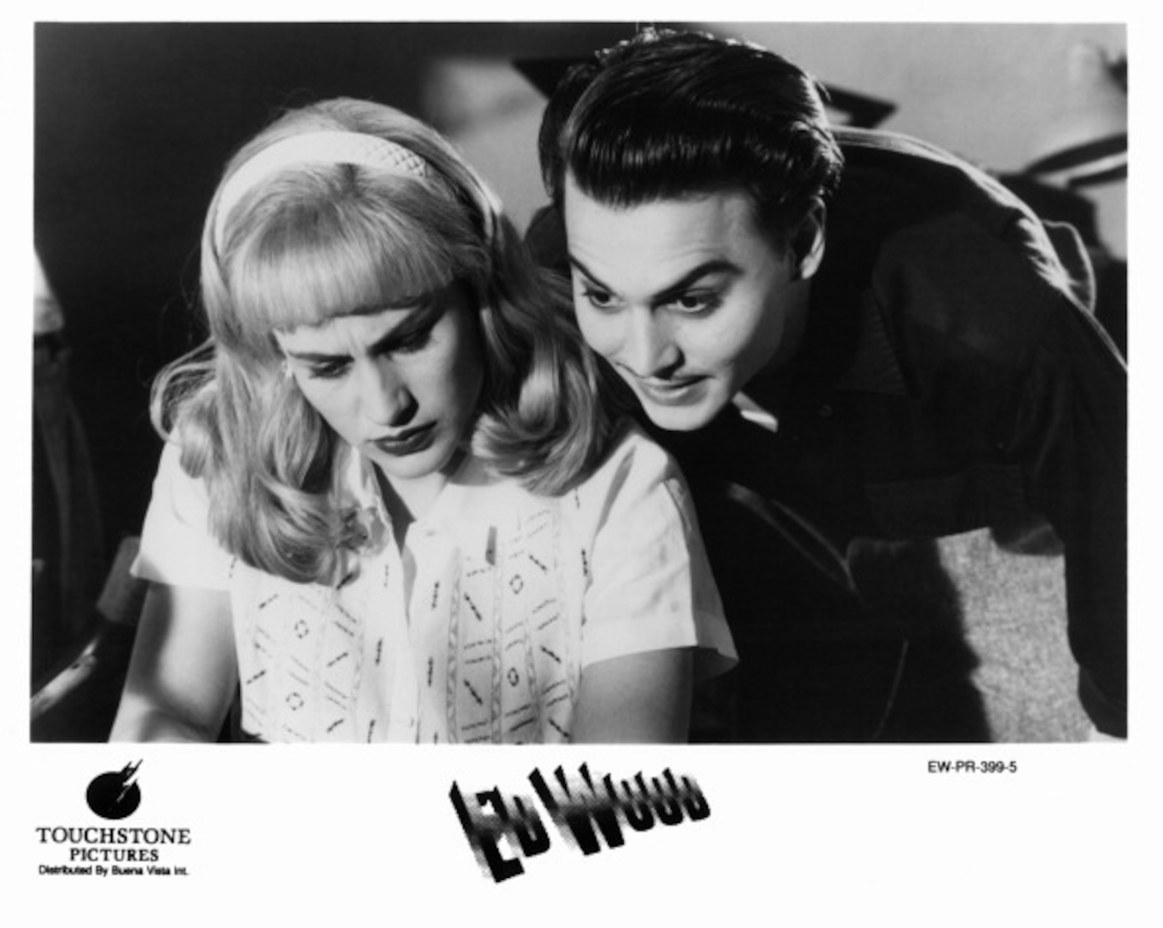 Johnny Depp standing over the shoulder of Patricia Arquette in a scene from the film 'Ed Wood', 1994. (Photo by Touchstone Pictures/Getty Images)