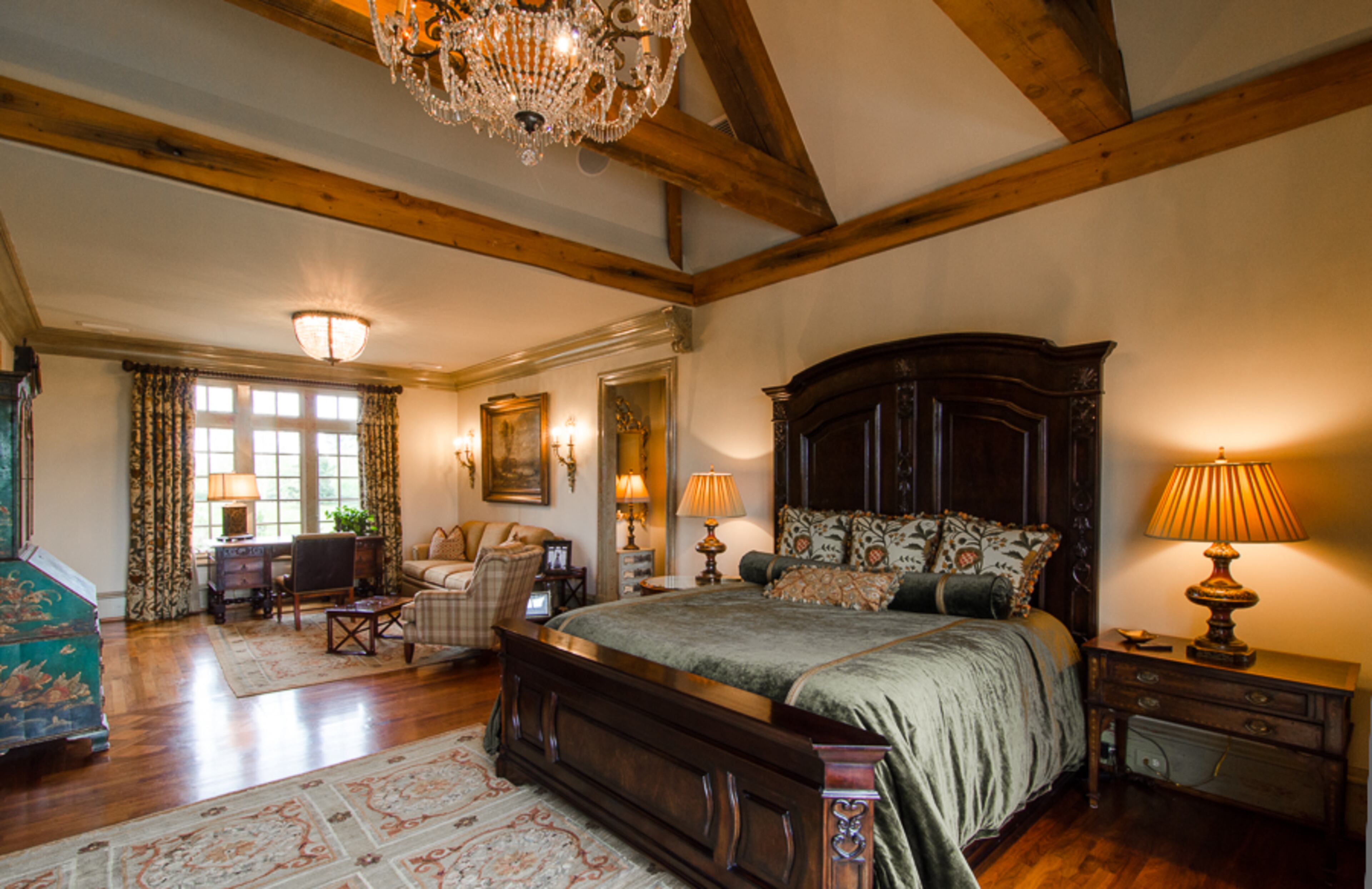 The master retreat is complete with sitting room, walnut floors, an intimate fireplace and luxurious bath. This home features five additional bedroom suites with private baths.