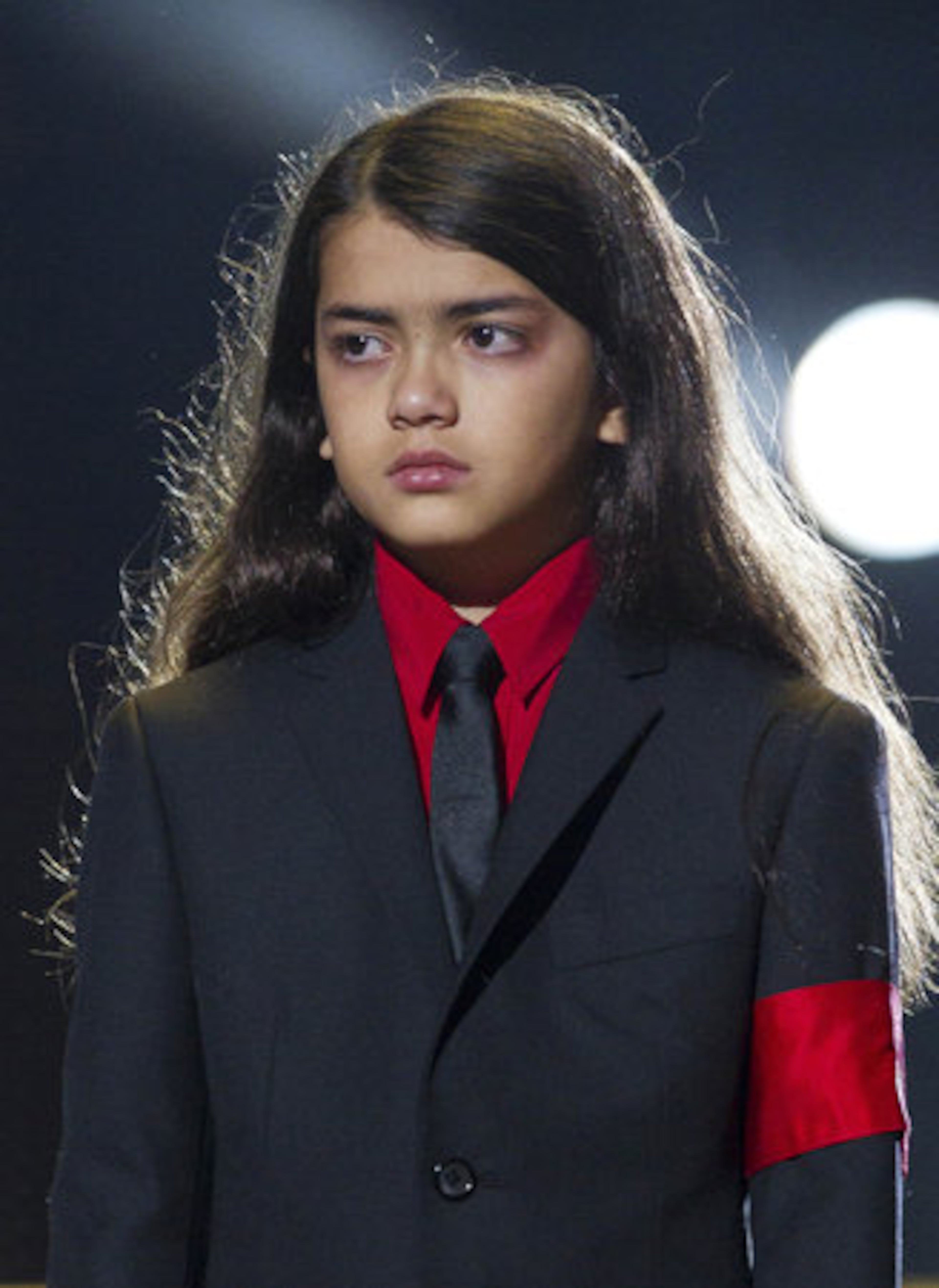 Blanket Jackson arrives on stage, sporting a red armband in honor of his famous father.