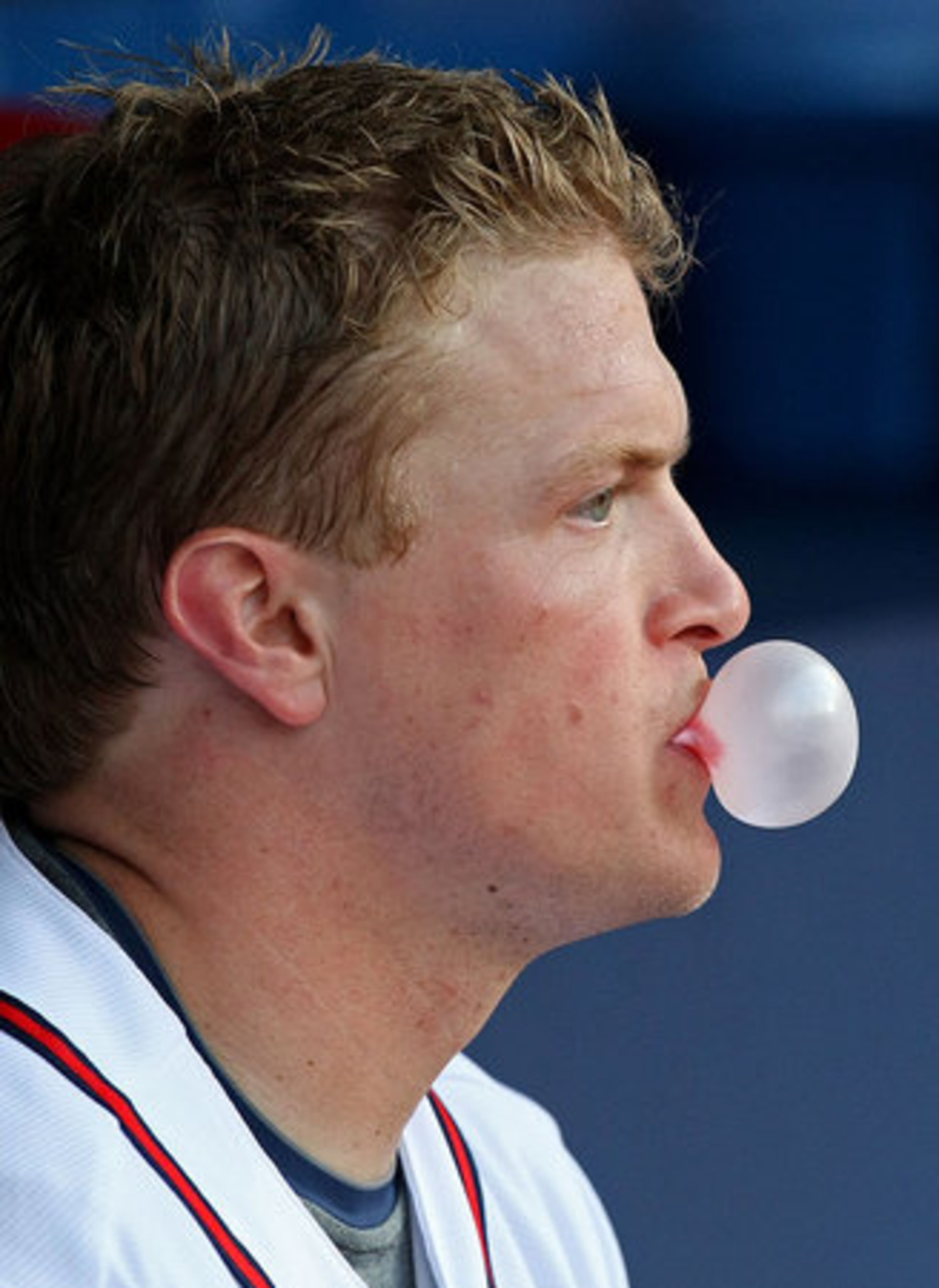 McLouth blows a bubble in the dugout during the 3rd inning.