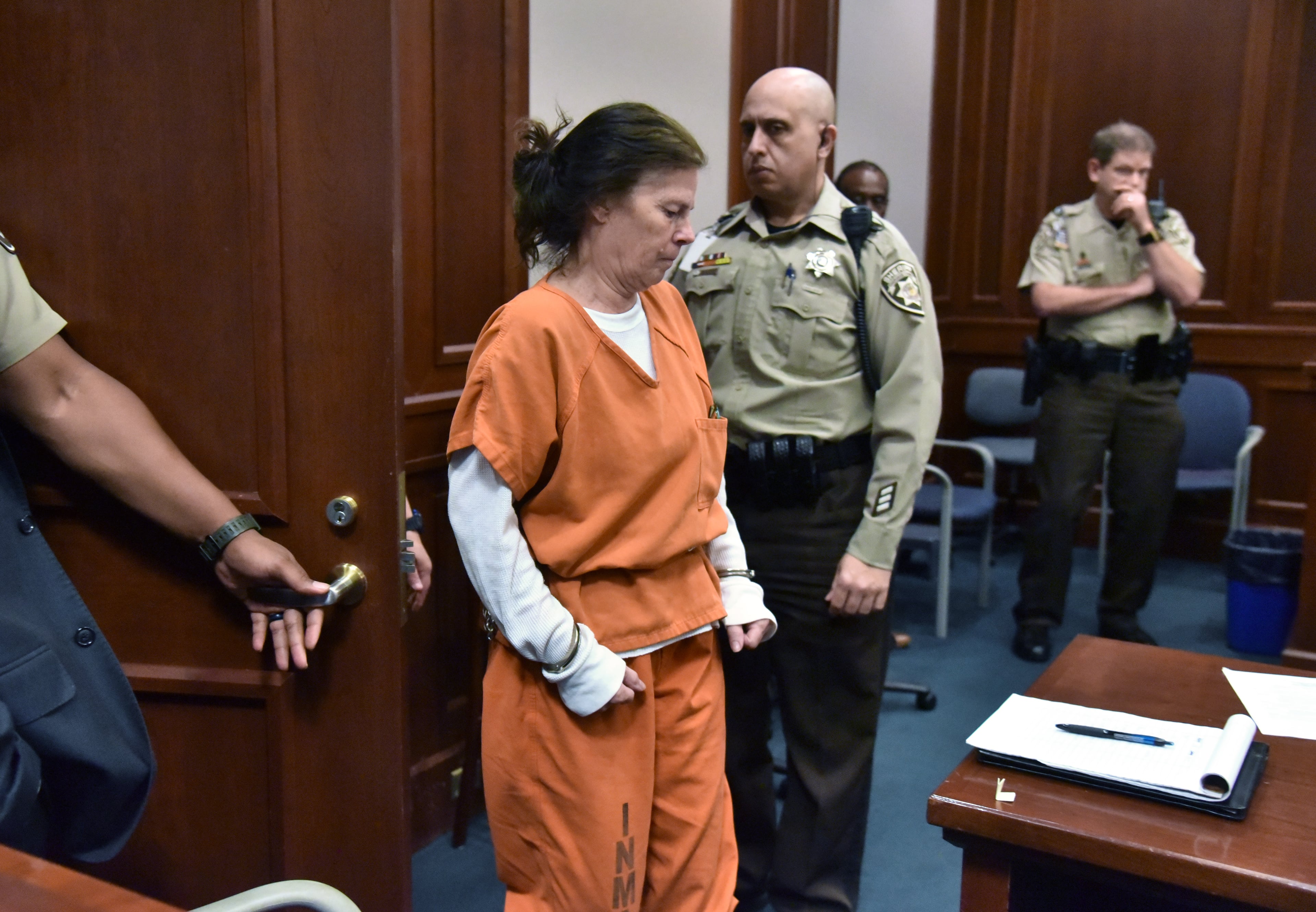 Melody Farris, pictured entering the courtroom for a hearing in July 2019, was convicted of killing her husband and burning his remains to cover up the crime. (Hyosub Shin/AJC 2019)