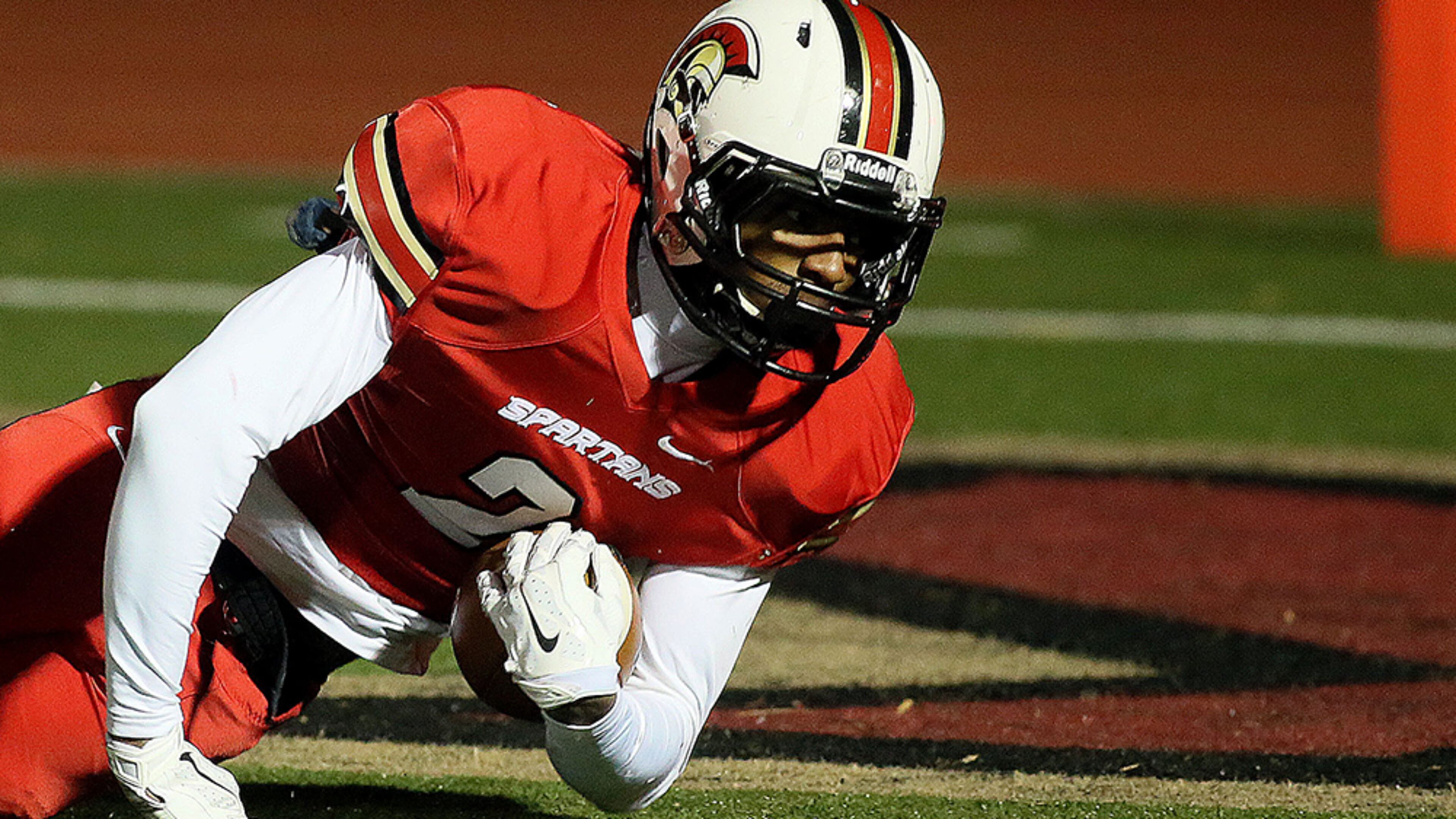 November 28, 2014-NORCROSS: Greater Atlanta Christian's # 2 Darius Slayton dives into the end zone for an early touchdown against the Vidalia Indians during the first half of their round three high school football playoff game at Spartan Stadium in Norcross on Friday November 28th, 2014. (Photo by Phil Skinner)