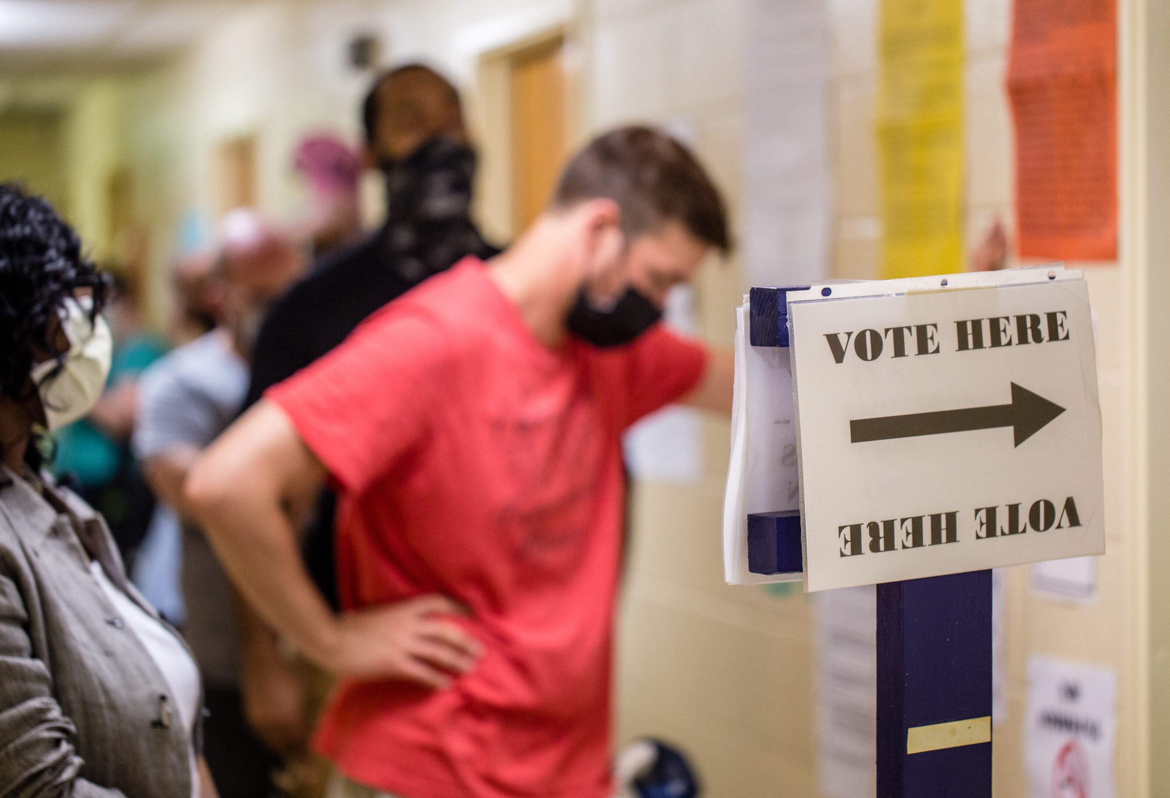 Voters wait in long lines, at times in the rain, at New Beginnings Full Gospel Church on Tuesday, June 9, 2020. The lines were taking more than 3.5 hours. This polling location opened at 7 am with only one machine of the four available working and had two of the four working at 4:30 and were not providing provisional ballots. (Jenni Girtman for The Atlanta Journal-Constitution)