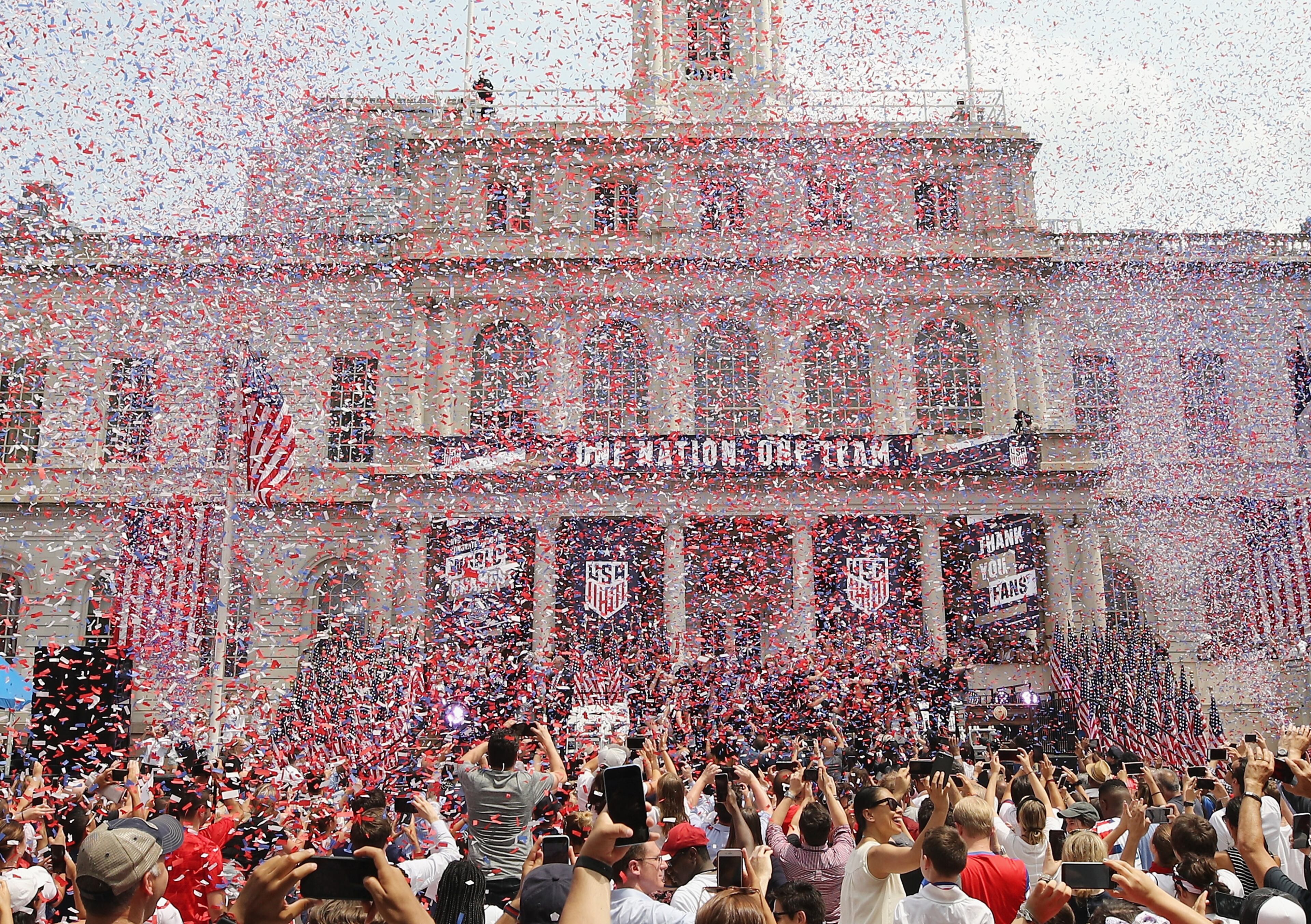 Behind all that confetti, members of the United States women's national coccer team are honored at City Hall on July 10, 2019, in New York City. The team, including Marietta native Emily Sonnett, took the Women's World Cup victor on Sunday, July 7, 2019, in France. (Photo by Bruce Bennett/Getty Images) *** BESTPIX ***