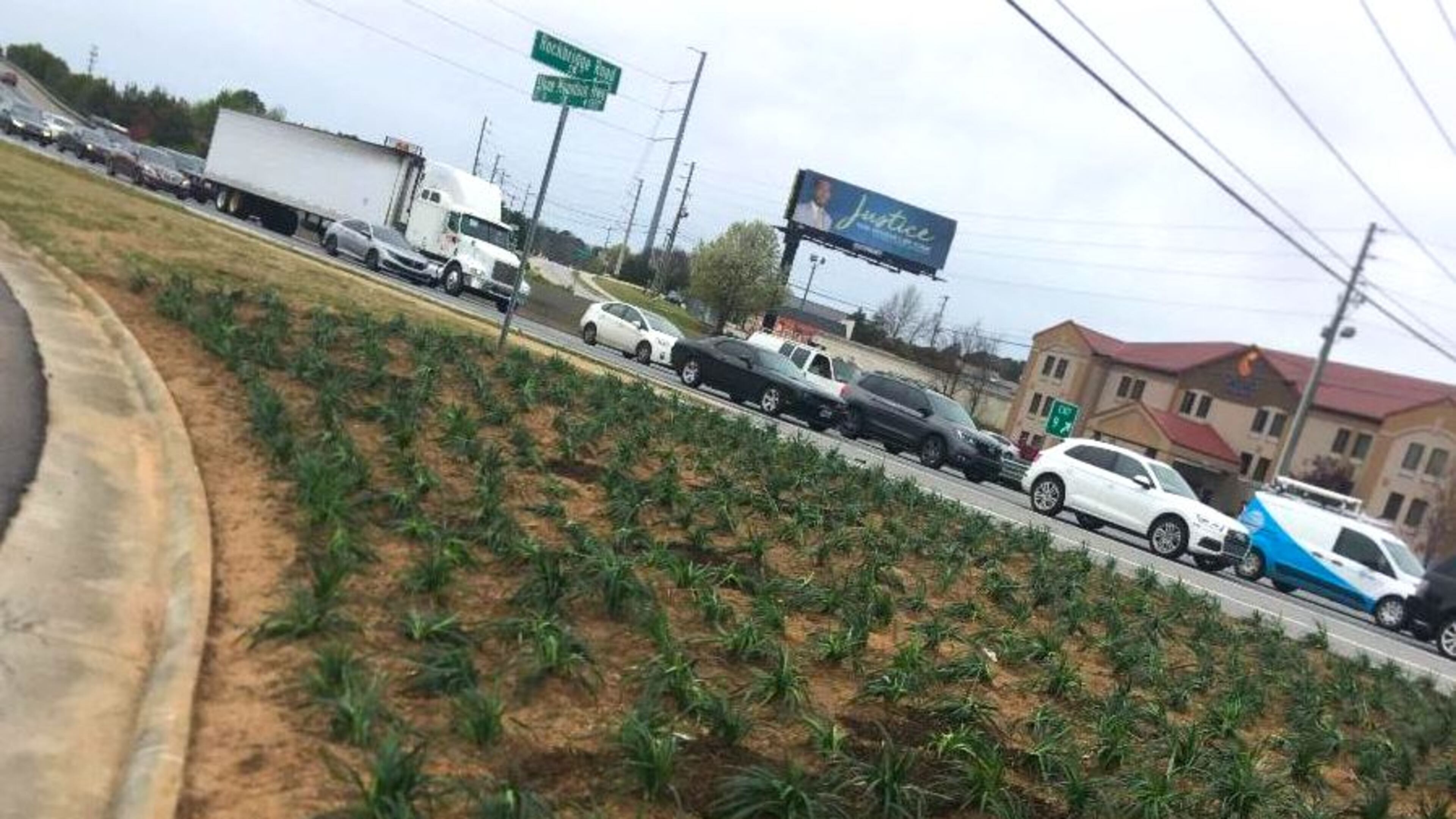 The Evermore CID’s landscaping crew recently removed juniper located in an island at Rockbridge Road and Stone Mountain Highway/Ga. 78 and replaced it with liriope. (Courtesy Evermore CID)