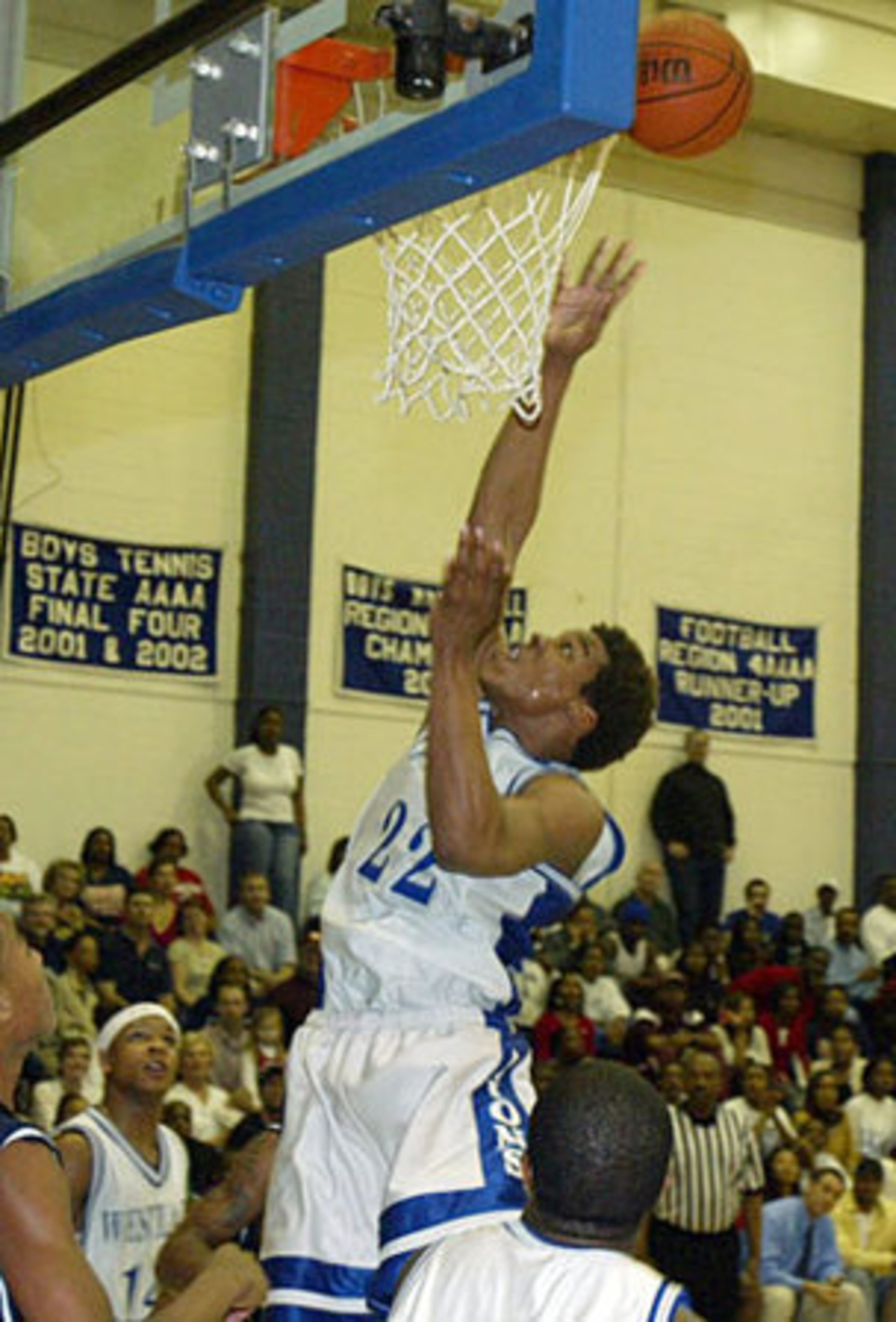 "Things came so easy for Cameron," former Westlake coach Dallas Allen says. Known for his football prowess, Newton (22, center) also shined on the basketball court. - Rana L. Cash