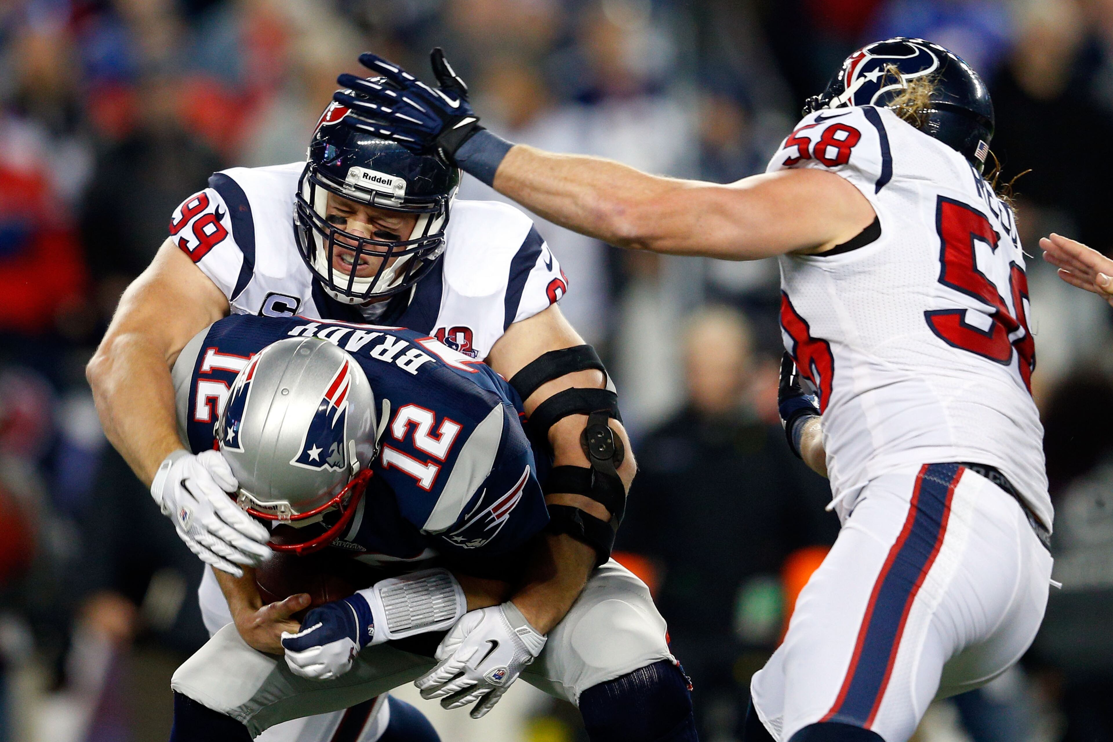 J.J. Watt sacks Tom Brady of the New England Patriots. (Photo by Jim Rogash/Getty Images)