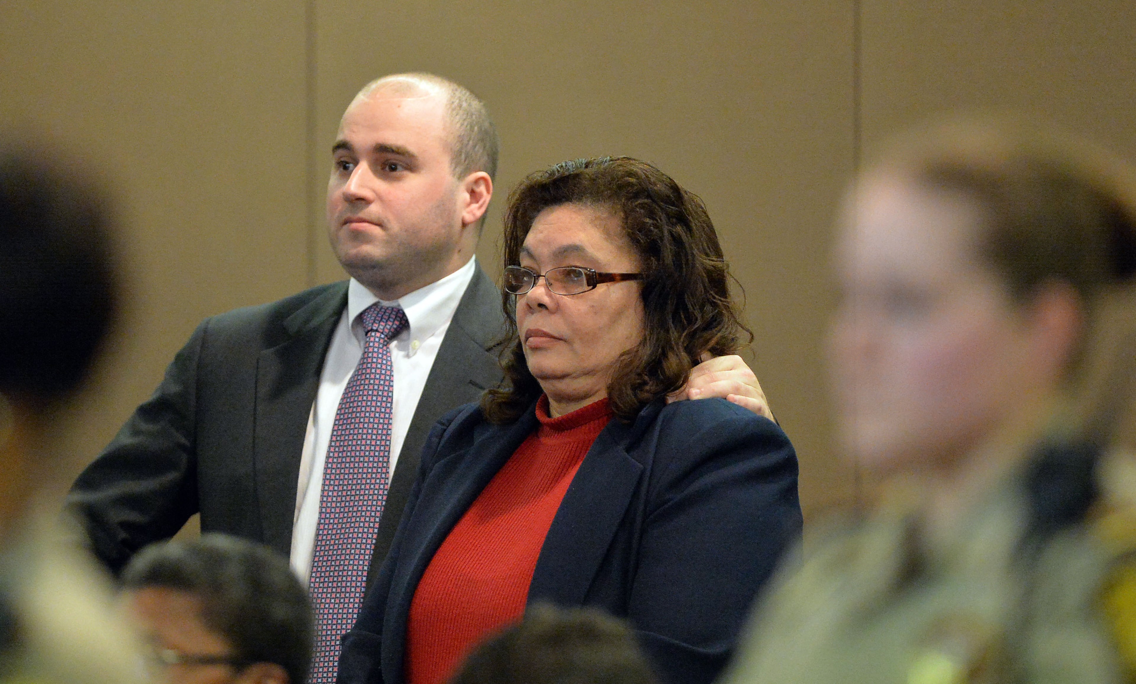 Former APS Benteen Elem testing coordinator Theresia Copeland is supported by her defense attorney Ryan Walsh as she hears the verdict convicting her of Violation of Racketeer Influenced and Corrupt Organizations Act charges Wednesday. A jury of six men and six women render convicted 11 of 12 defendants on RICO and other assorted charges on their eighth day of deliberations in the Atlanta Public Schools test-cheating trial on Wednesday, April 1, 2015. Jurors sorted through roughly five months of testimony against 12 former educators accused of engaging in a racketeering conspiracy to inflate test scores. (Atlanta Journal-Constitution, Kent D. Johnson, Pool)