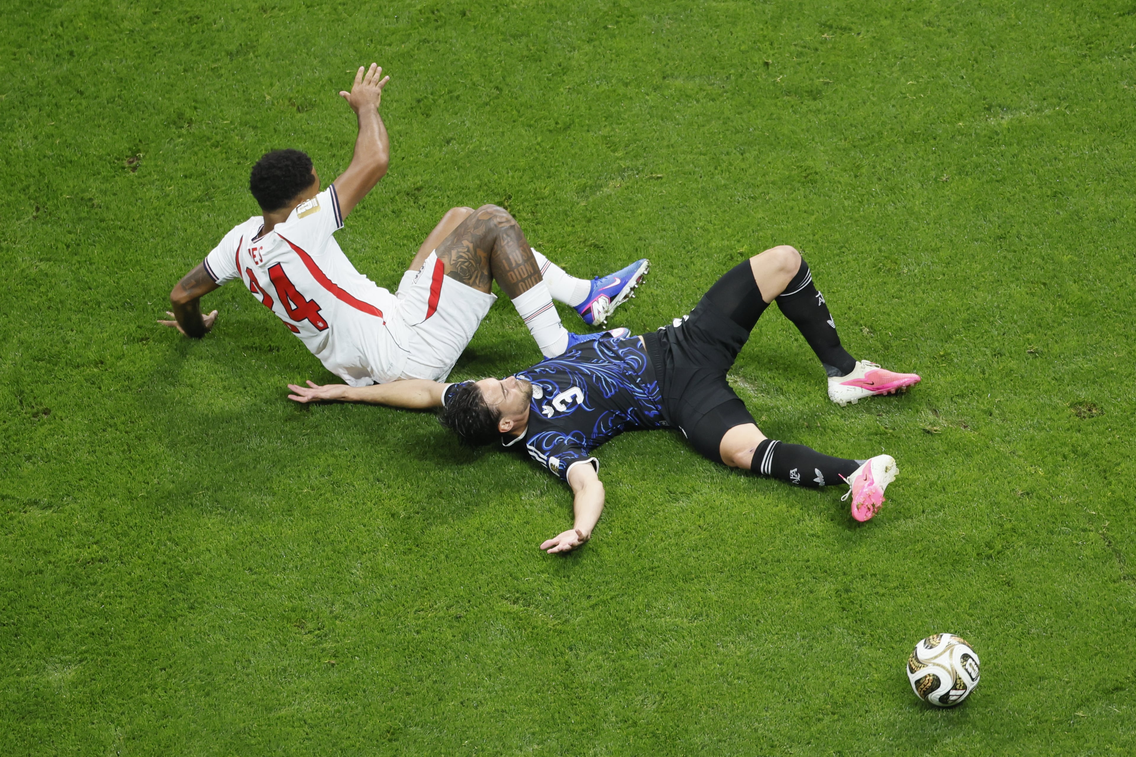 England's Reece James, left and Argentina's Nicolas Tagliafico collide during first half of Argentina vs. England FIFA World Cup Semifinal match at Atlanta Stadium (Mercedes-Benz Stadium) on Wednesday, July 15, 2026. (Miguel Martinez/AJC)