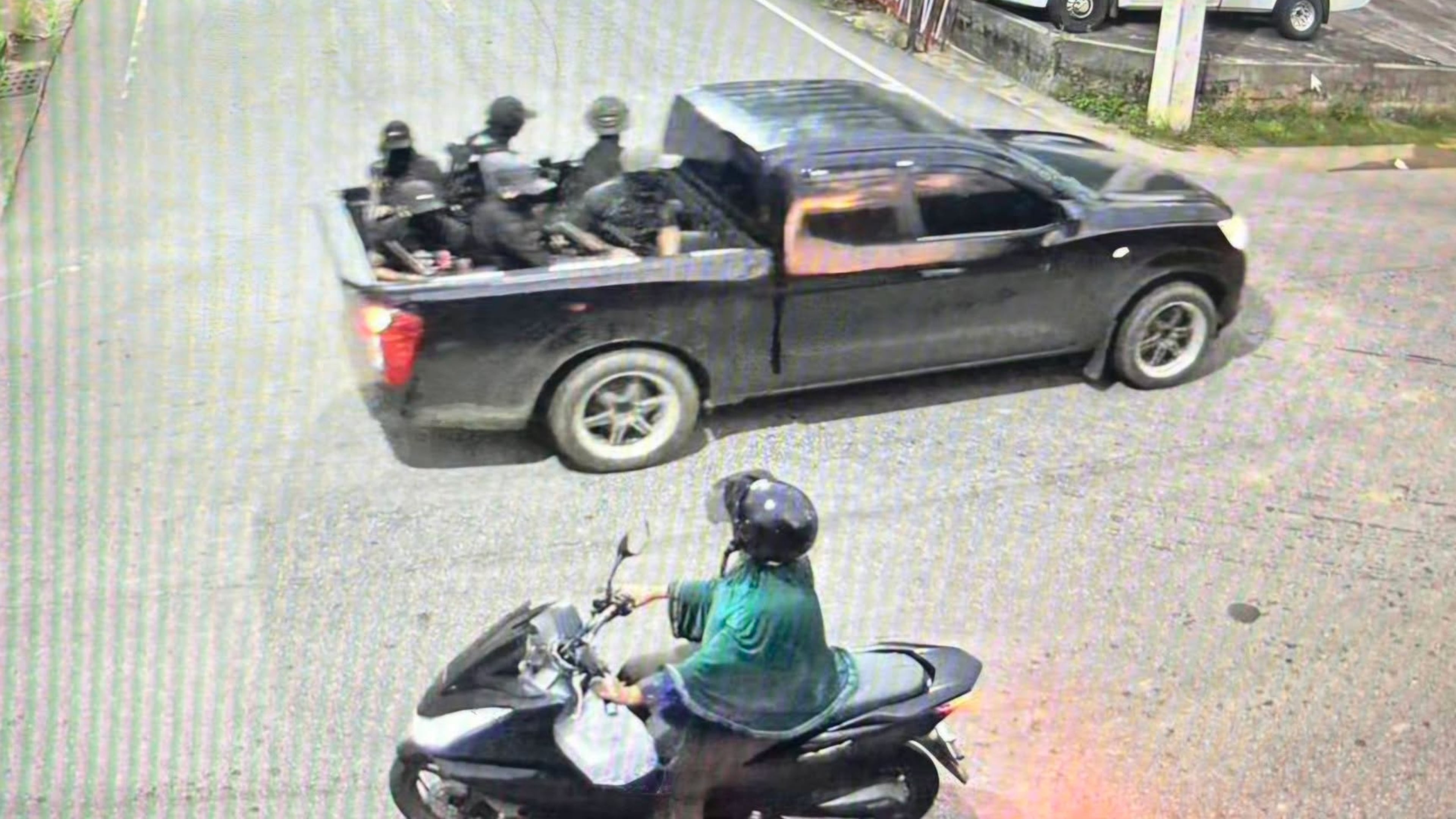 This image taken from video provided by Internal Security Operations Command Region 4 shows a group of the alleged attackers riding on a back of a black pickup truck before they opened fire and threw pipe bombs at soldiers at a security checkpoint in Narathiwat province, Thailand, Wednesday, July 22, 2026. (Internal Security Operations Command Region 4 via AP)