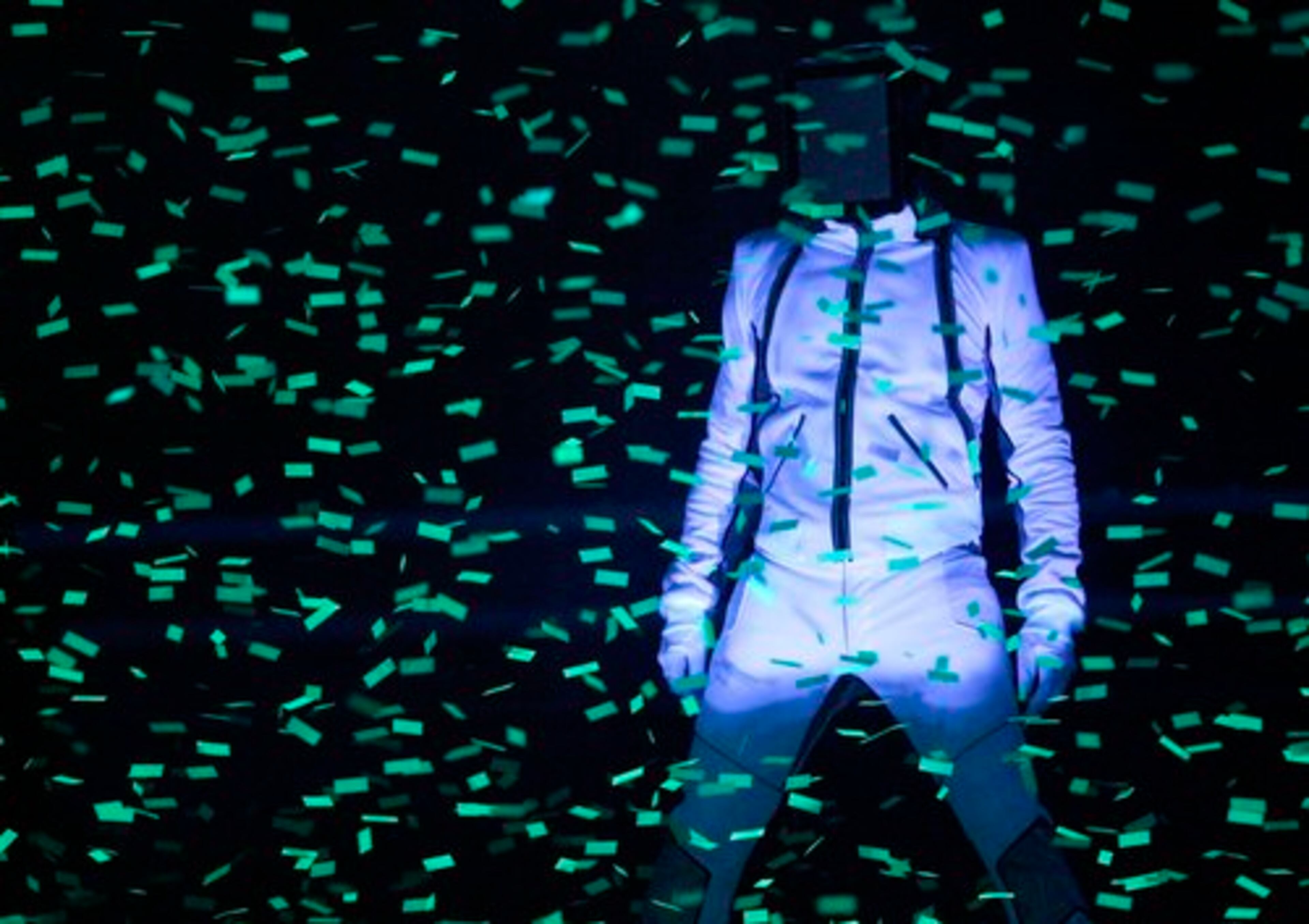 A glowing-in-the-dark will.i.am performed his new single "Hard."