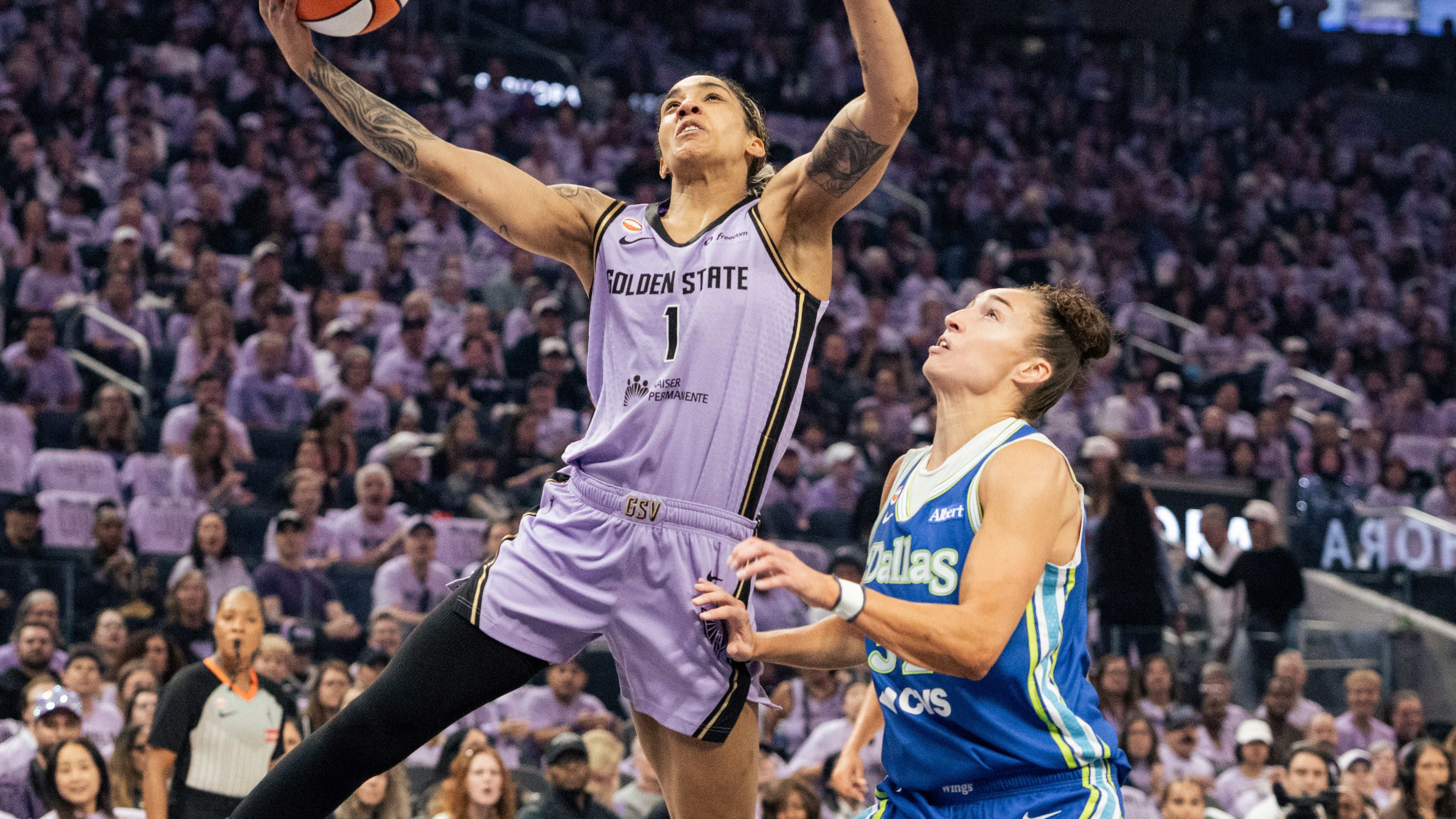 Golden State Valkyries forward Gabby Williams (1) drives for a layup against the Dallas Wings during the first quarter of Game 3 of a WNBA basketball first-round playoff series Friday, Oct. 2, 2026, in San Francisco. (Stephen Lam/San Francisco Chronicle via AP)