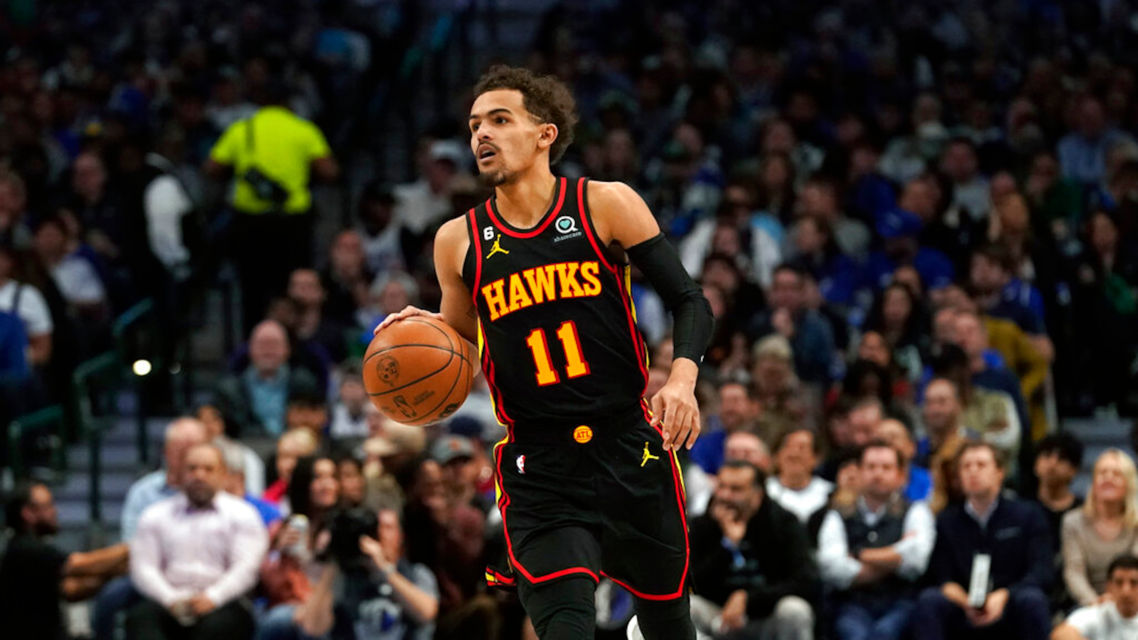 Atlanta Hawks guard Trae Young (11) dribbles during the second half of an NBA basketball game against the Dallas Mavericks in Dallas, Wednesday, Jan. 18, 2023. Hawks won 130-122. (AP Photo/LM Otero)