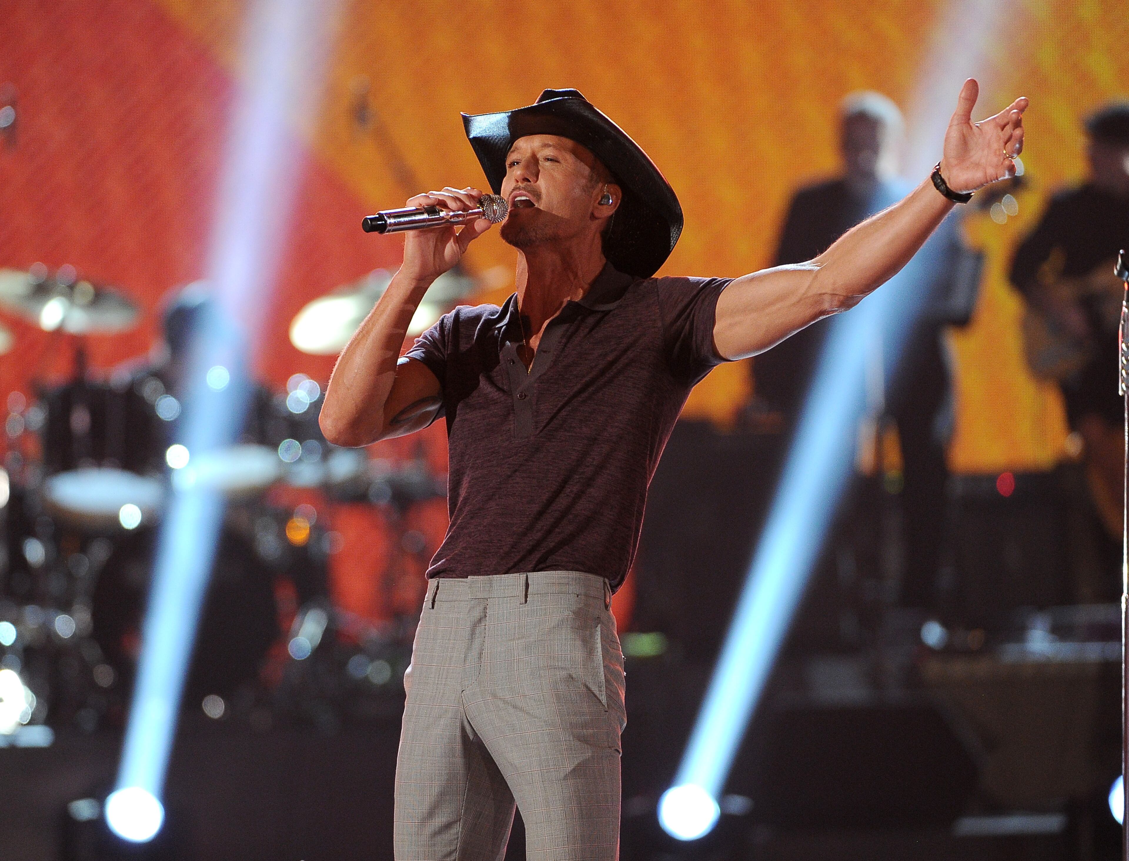 Tim McGraw performs at ACM Presents an All-Star Salute to the Troops on Monday, April 7, 2014, in Las Vegas. (Photo by Chris Pizzello/Invision/AP)