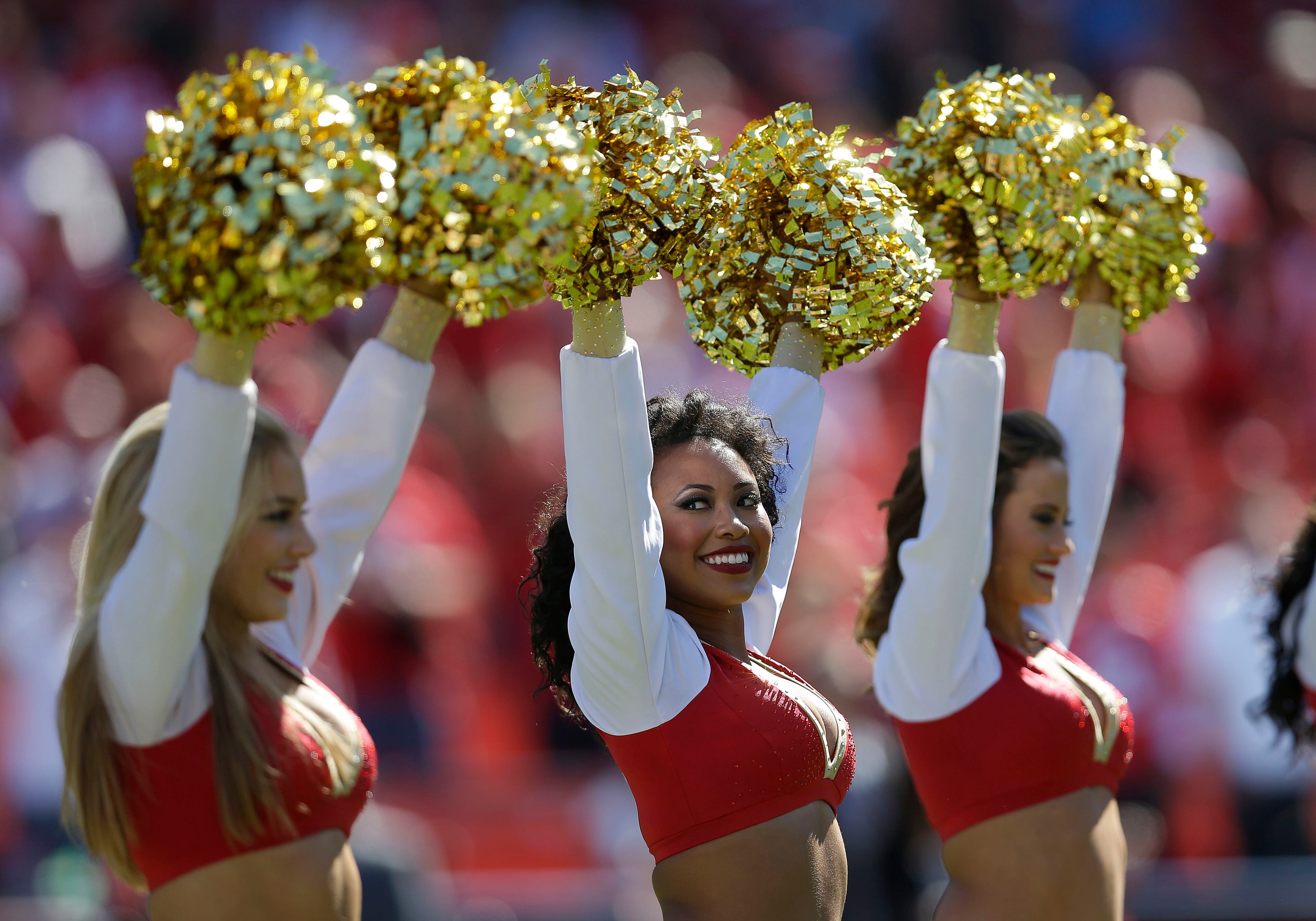 San Francisco 49ers cheerleaders perform before an NFL football game against the Arizona Cardinals in San Francisco, Sunday, Oct. 13, 2013. (AP Photo/Marcio Jose Sanchez)