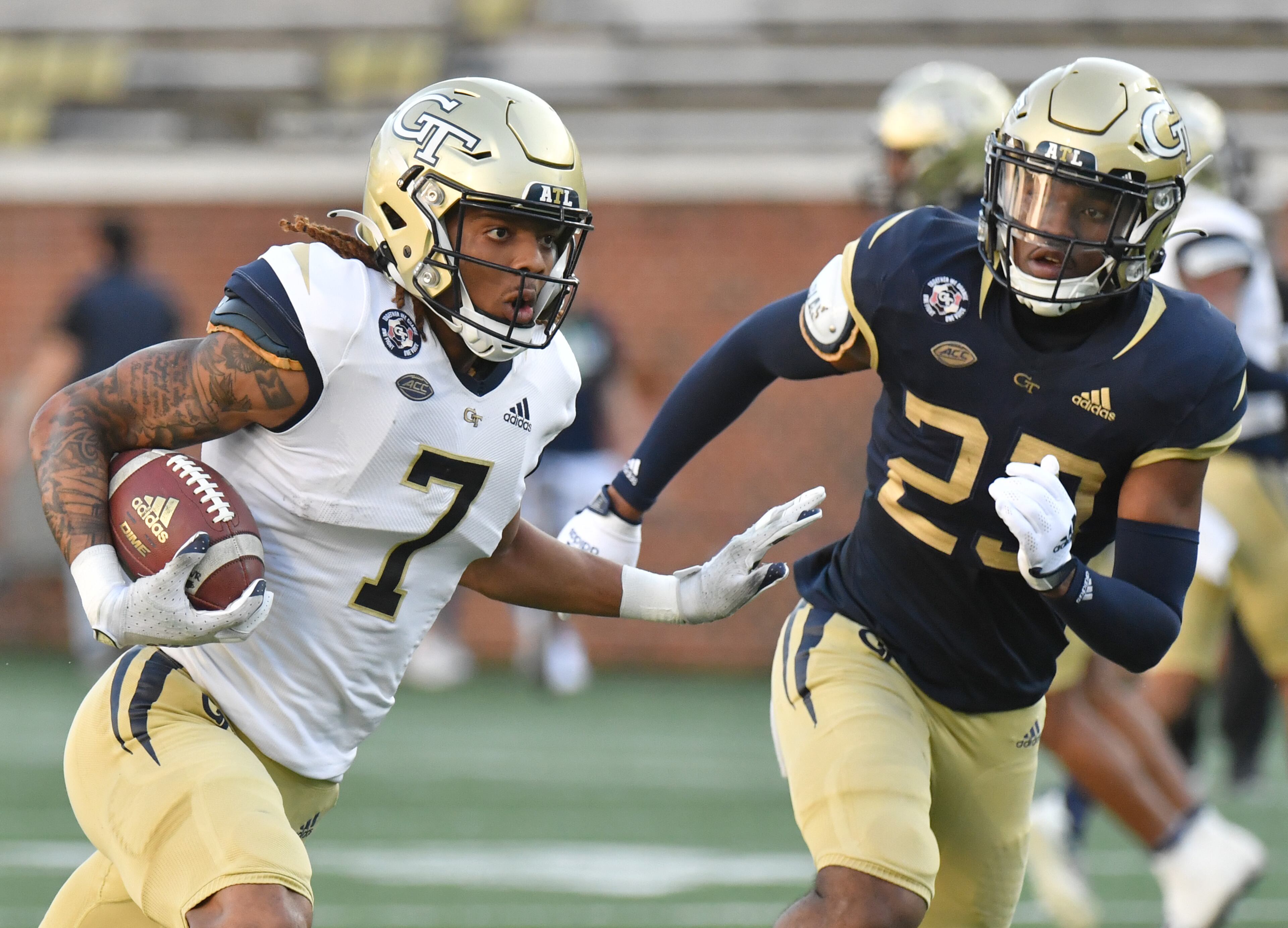 Georgia Tech's wide receiver Malachi Carter (7) rushes against defensive back Khari Gee (23) during the 2022 Spring Game at Georgia Tech's Bobby Dodd Stadium in Atlanta on Thursday, March 17, 2022. (Hyosub Shin / Hyosub.Shin@ajc.com)